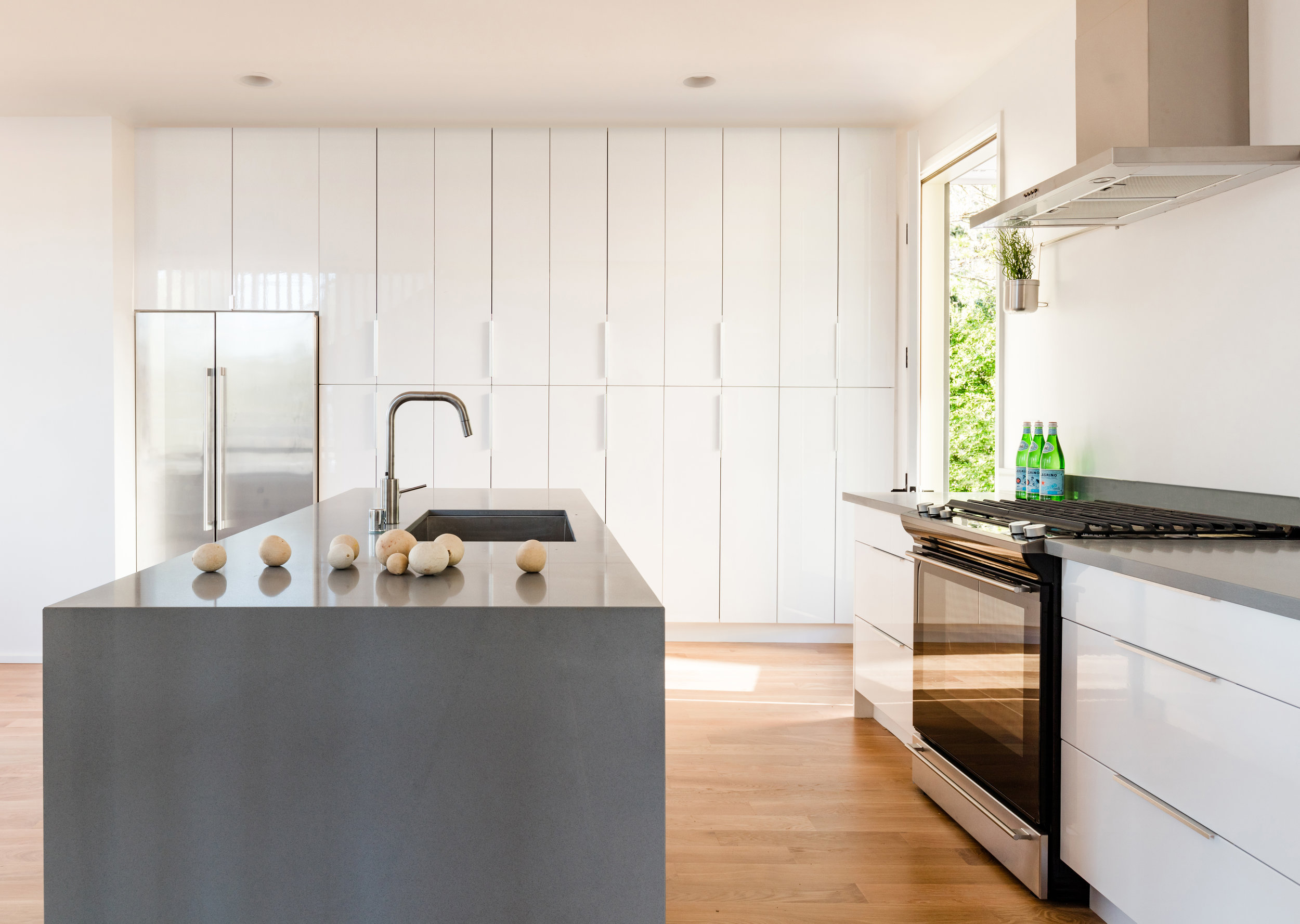 The kitchens include generous pantries with ample storage, and are built with simple and affordable materials of quartz, stainless steel, and high gloss laminate casework.