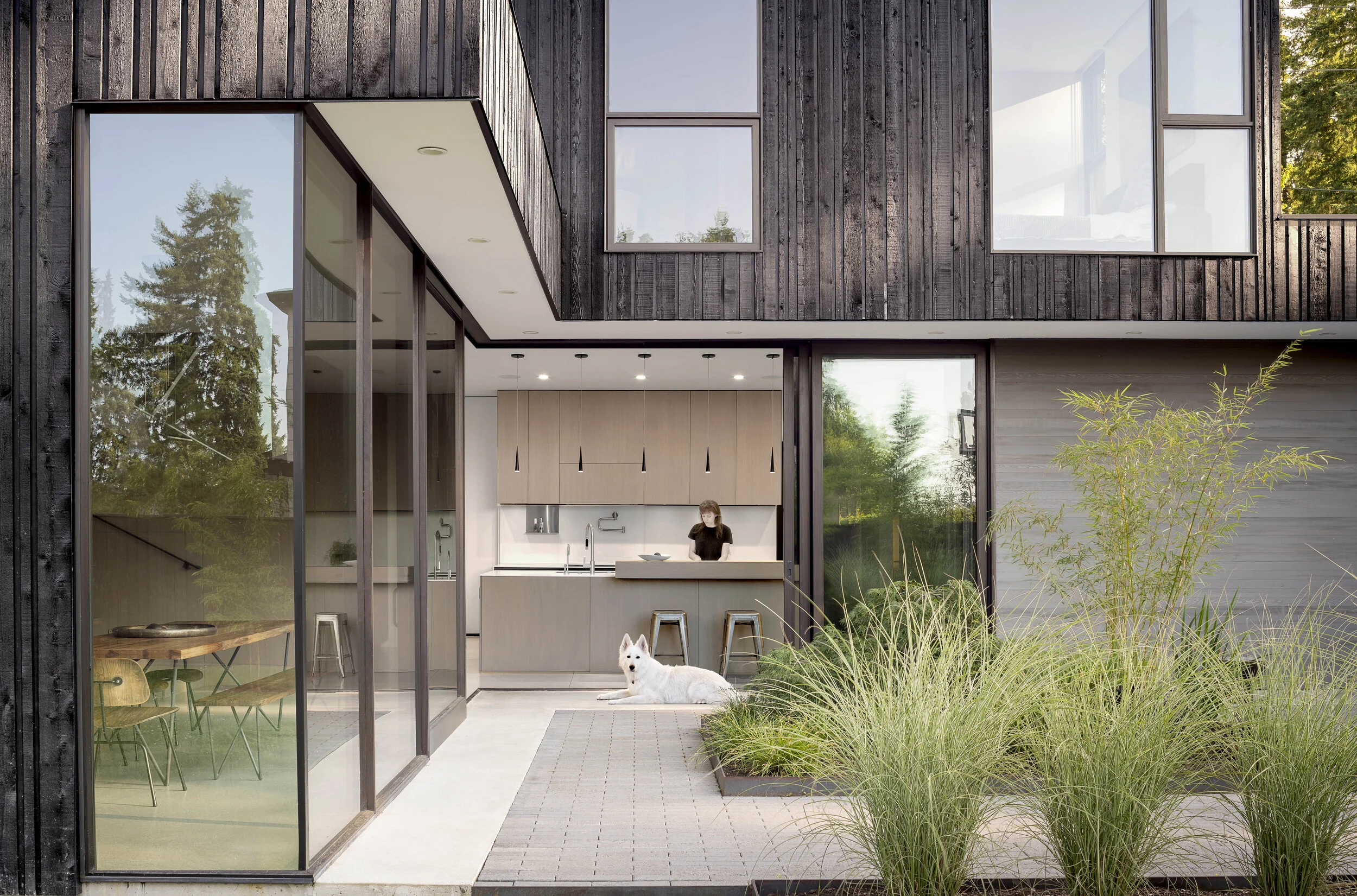YO-JU COURTYARD HOUSE - Clyde Hill, WA Through a series of thresholds from opaque to transparent, Yo-Ju Courtyard House, which means “secluded living” in Mandarin Chinese, embraces the future of suburban density by establishing a private experience despite being adjacent to a busy arterial street in the Clyde Hill neighborhood of Bellevue. Design Team: Matt Wittman, Jody Estes, Ashton Wesely. Contractor : DME Construction. Photography : Andrew Pogue