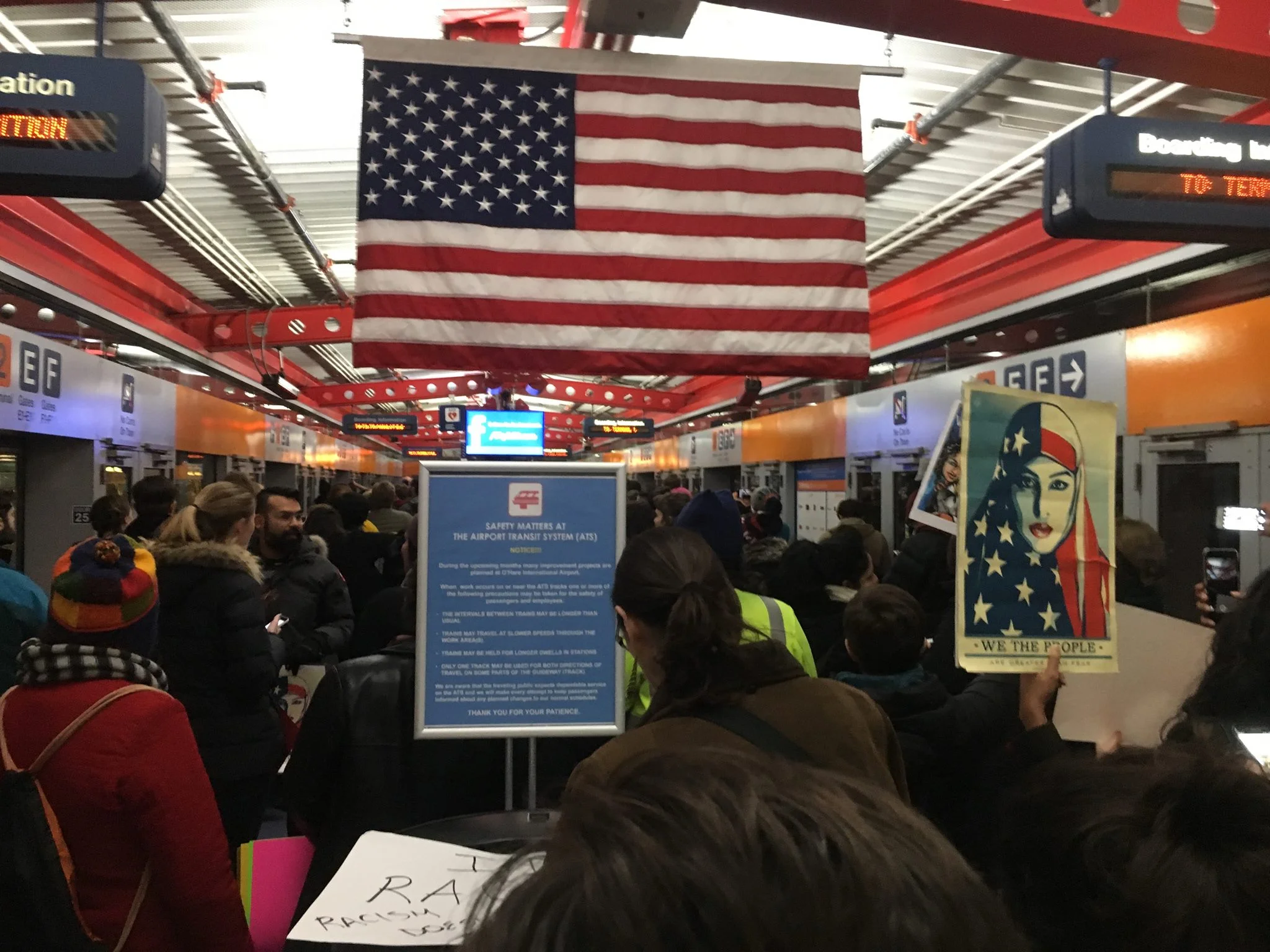 Vince's view of the crowd on the tram on the way to Terminal Five at the airport Saturday, January 28th to protest the new immigration ban.