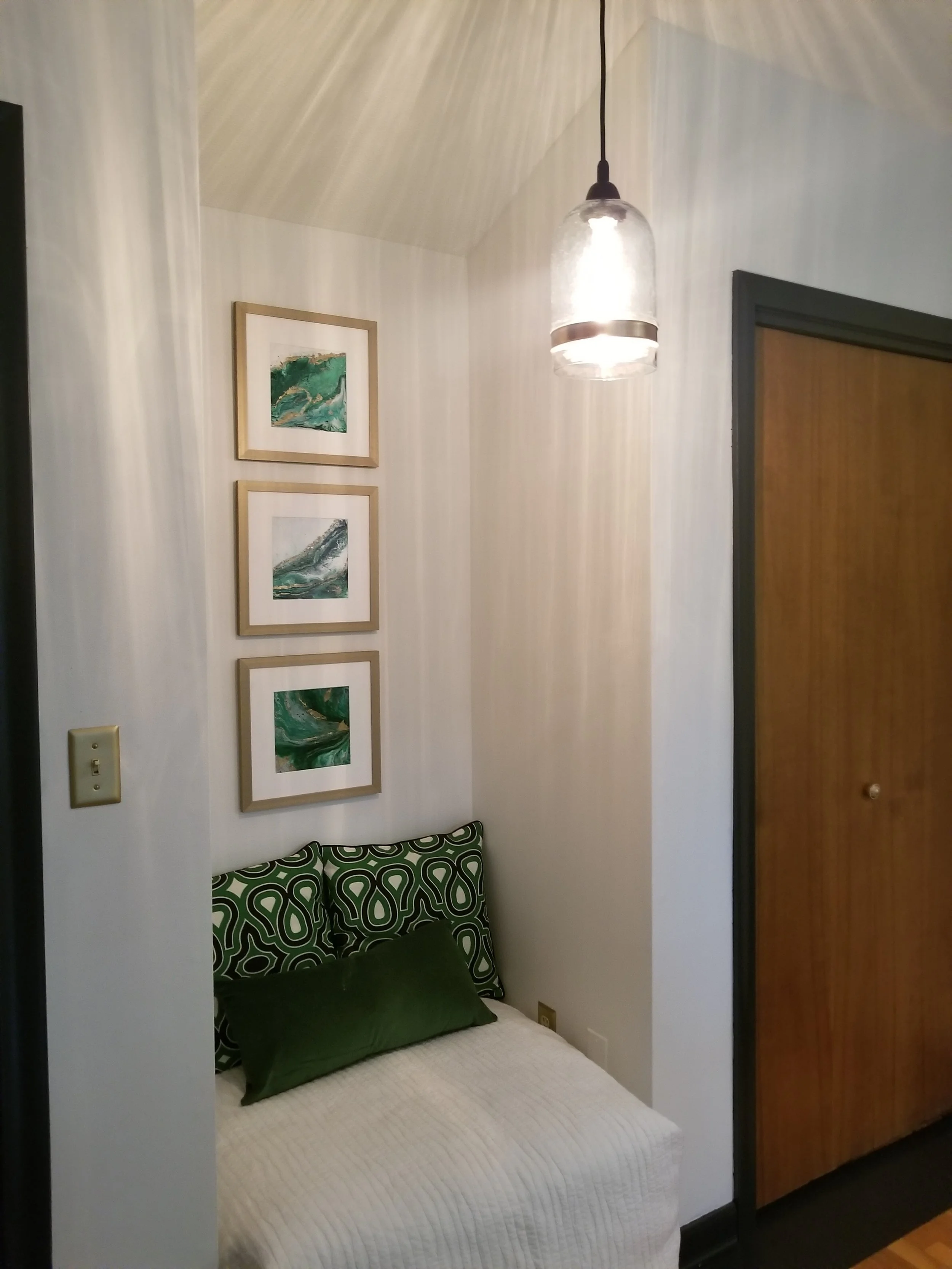 A cozy little nook, I had the green artwork previously in my dining room and it fits nicely in this space.