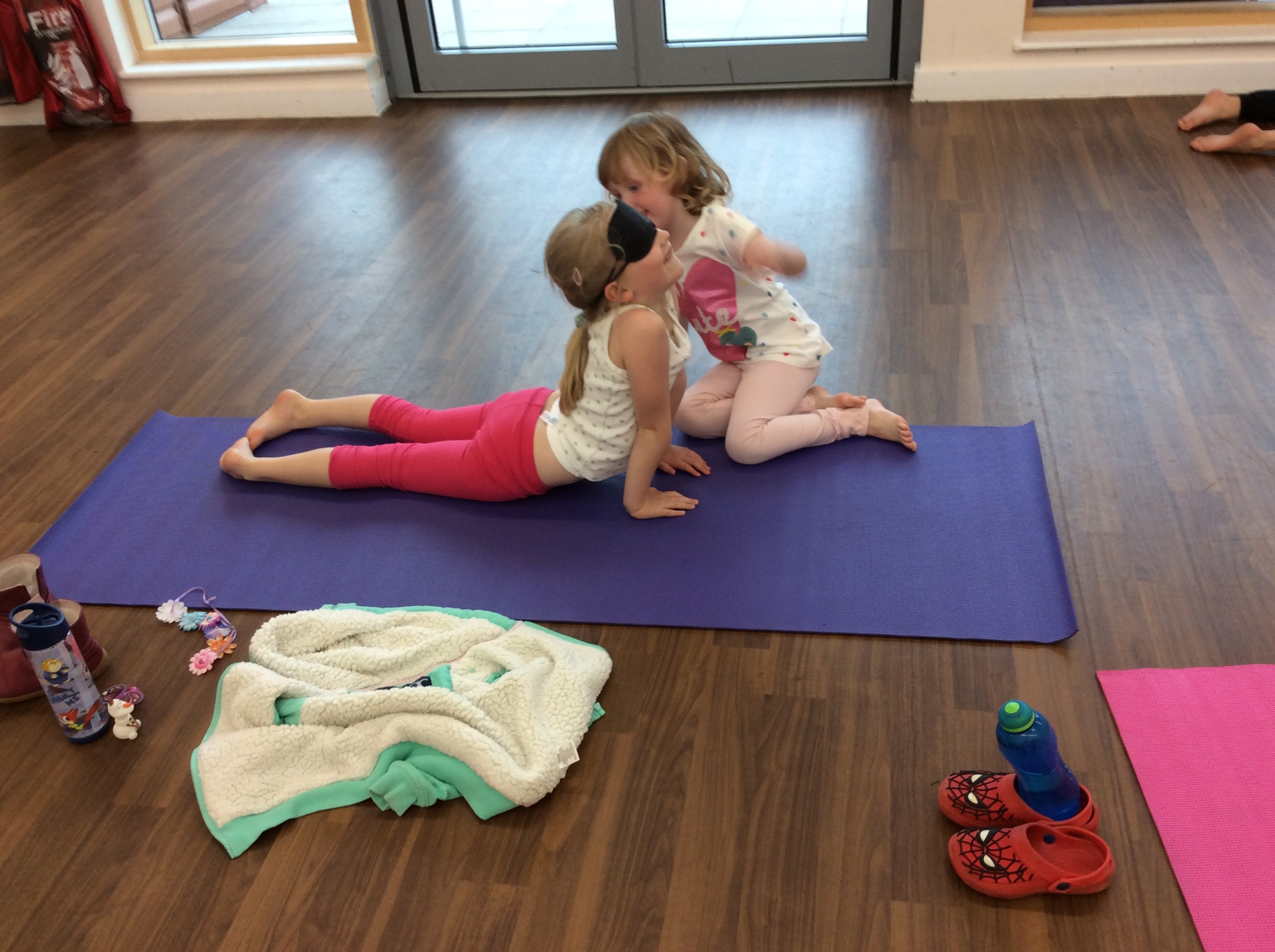 Wearing blindfolds in yoga has been challenging but very fun! We put a blind fold on, Melissa strikes a yoga pose and our partner has to describe the pose to us without telling us what it is!