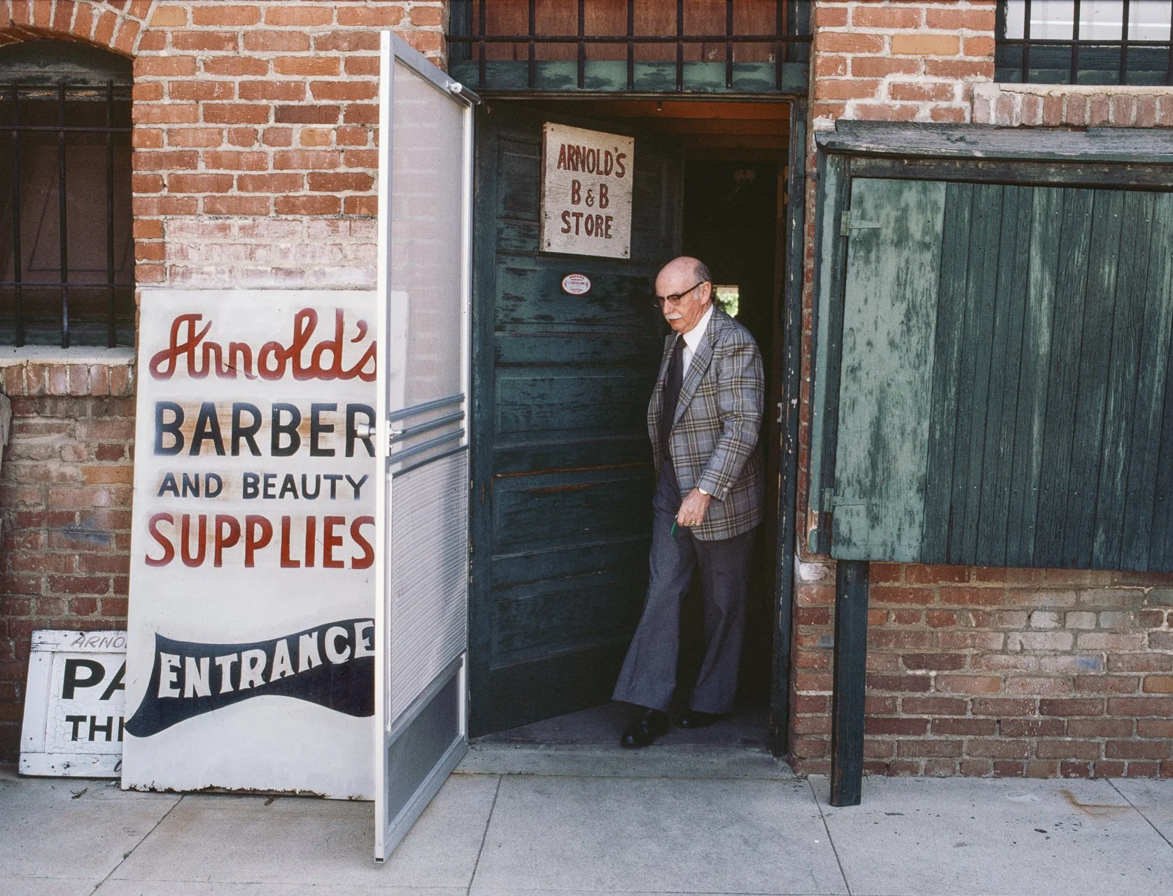  JANET DELANEY  Arnold's Barber and Beauty Supplies , 1980 Archival Pigment Print, 2026 13 x 19.5 in (33.02 x 49.53 cm), edition of 5 +2AP 28 x 42 in (71.12 x 106.68 cm), edition of 2 + 1AP   INQUIRE  
