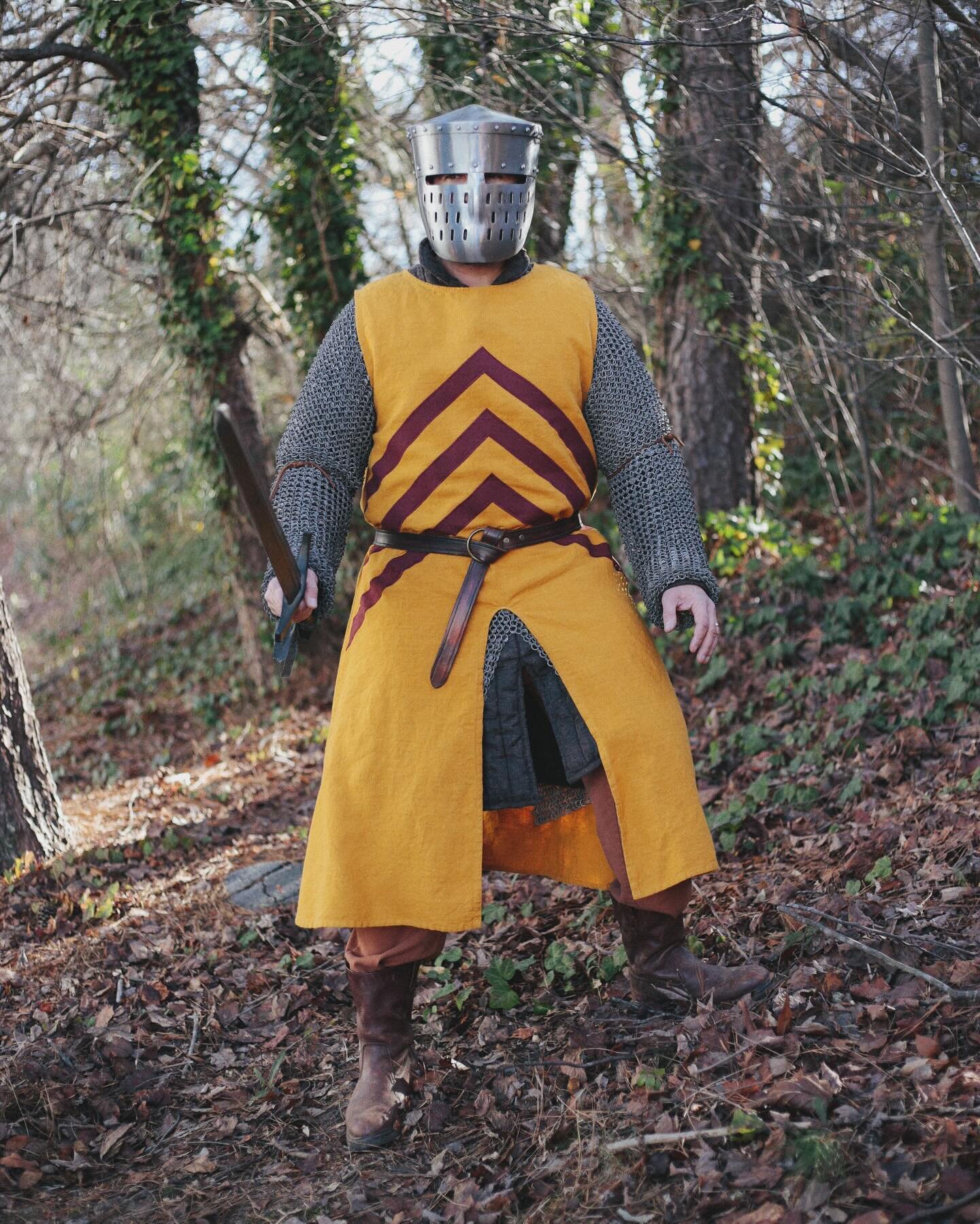 BARONY FEATURE: Reynard de Clare, Earl of Hereford
Played by: Dallin Rivera @farstridingranger 
&mdash;
Coat of arms: Or, three chevrons gules
Surcoat Color: Golden Yellow
&mdash;
Sir Reynard de Clare marches into battle with his three red chevrons o