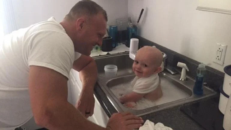 Trooper Graham and baby; Photo: West Virginia State Police