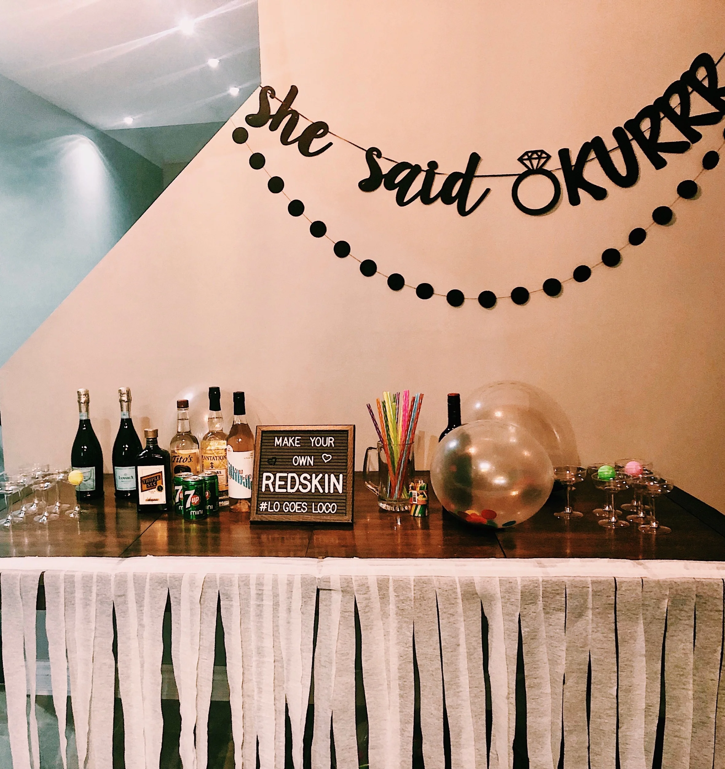Prosecco pong and a Cardi B engagement banner!