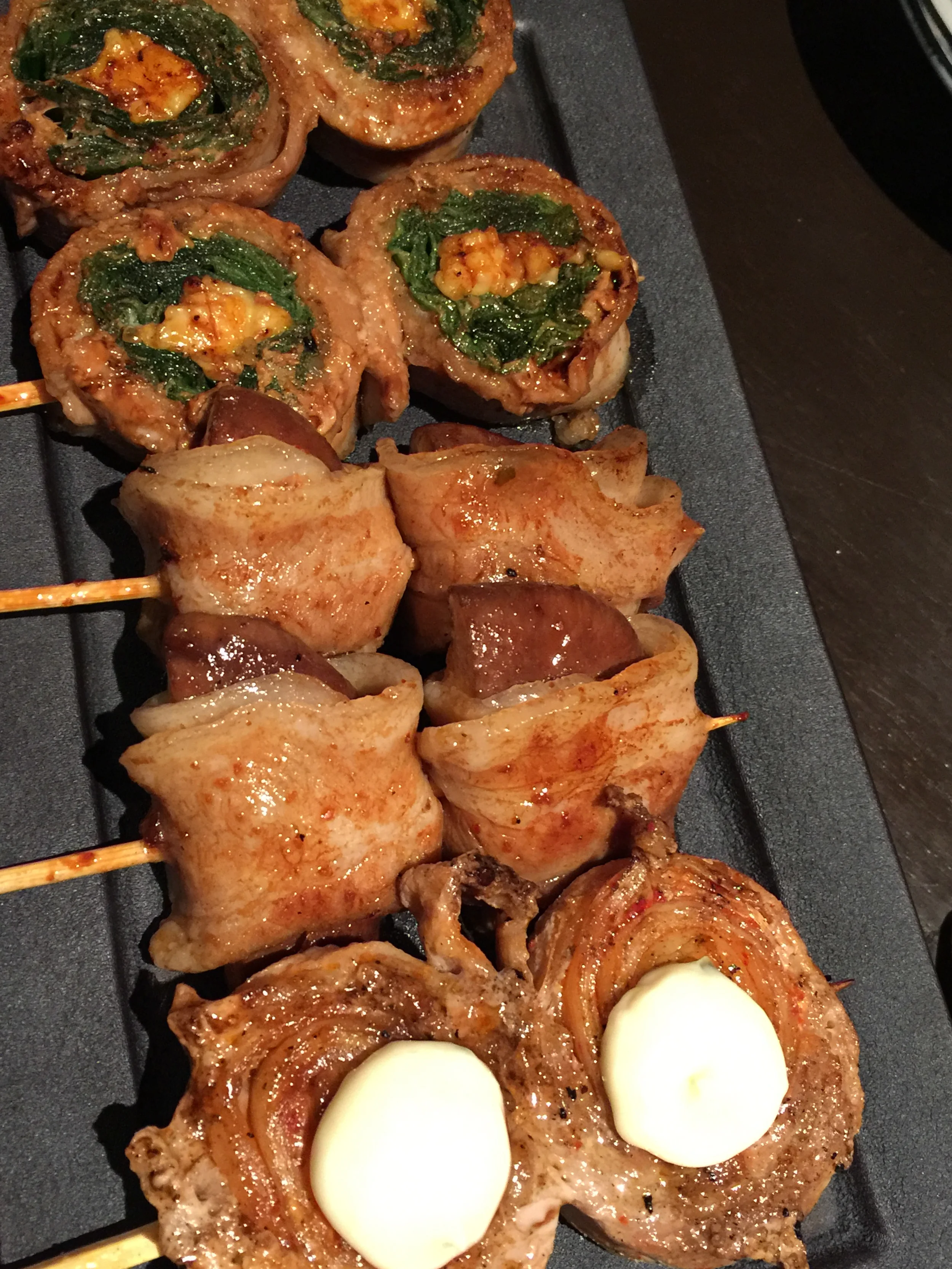 Pork Wrapped grilled skewers, mushroom, spinach, kimchi