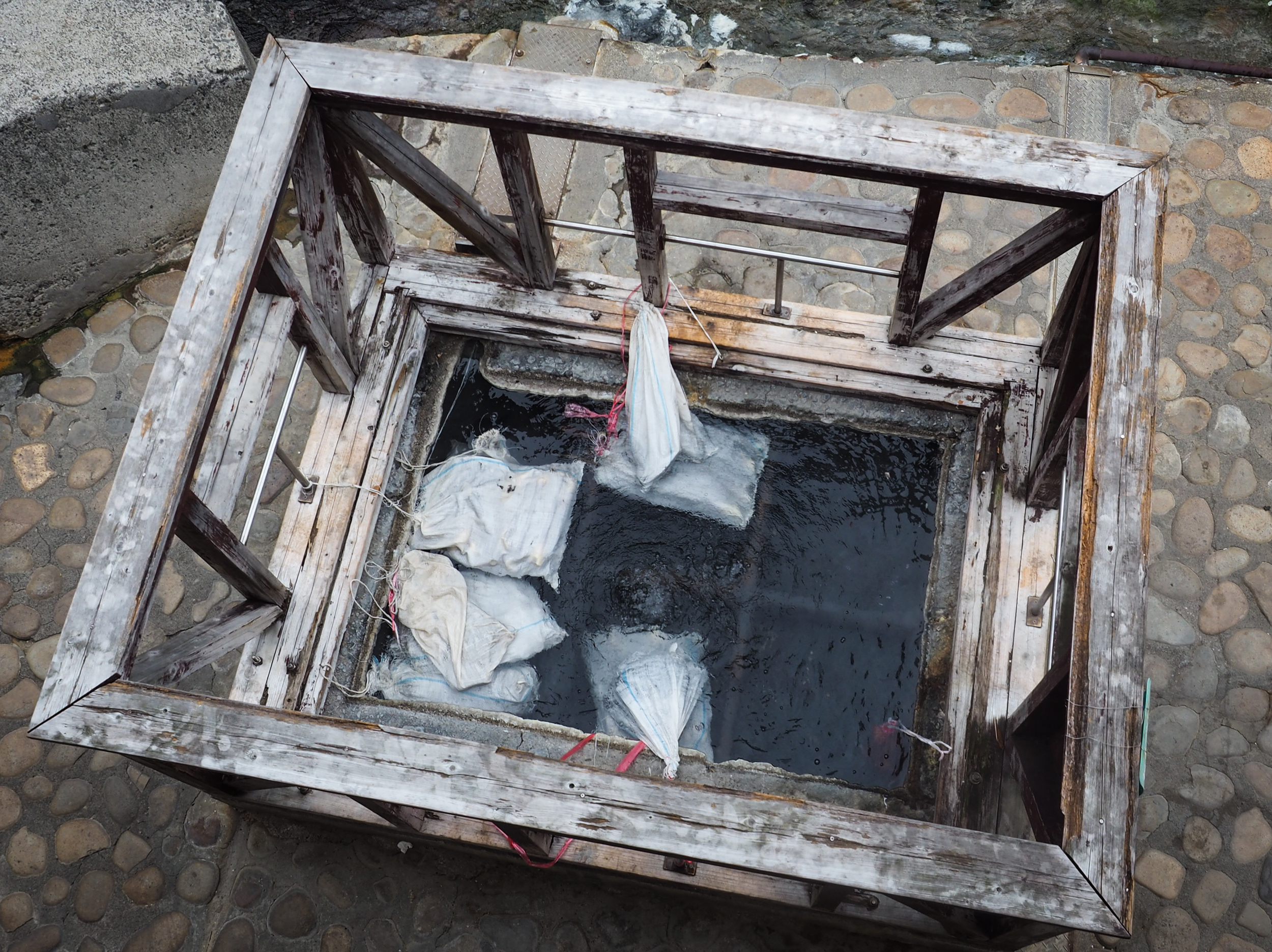 Bags of eggs inside the public onsen cooking basin