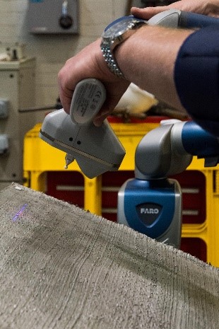 Laser-scanning a 3D-printed stainless steel sheet. This produces high-resolution data that will ultimately enable engineers to better understand the material properties of printed steel.