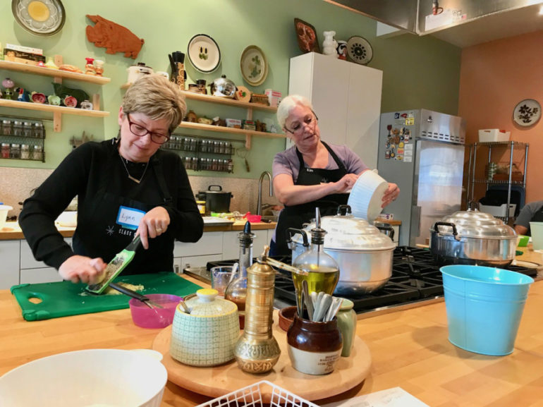 Lynn Peterson, left, and Kim Mahan take part in a dim sum class at Class Cooking. Photos by Rachel Pinsky