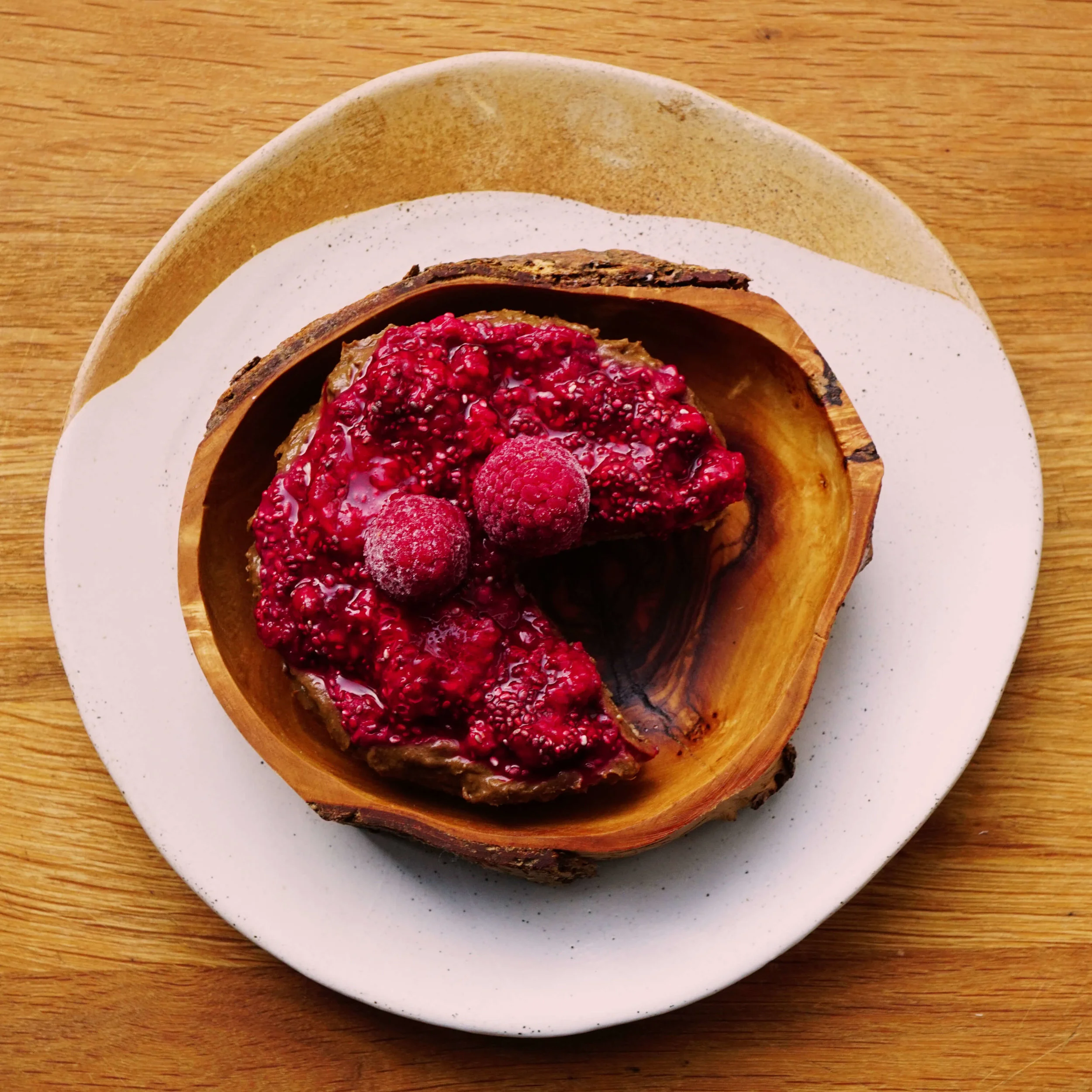 Raw cacao tart with raspberry chia jam
