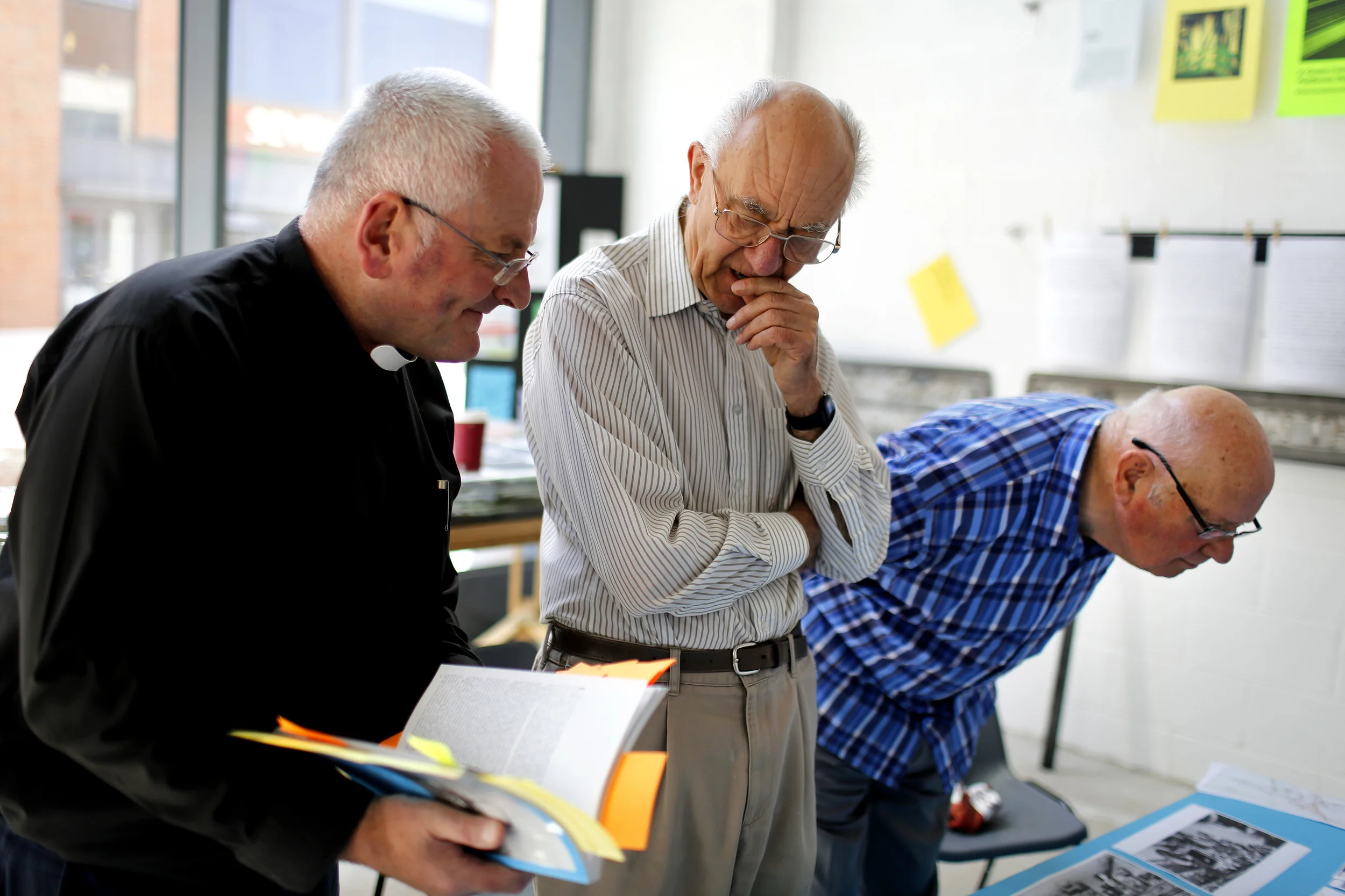 John Baker with Rev'd Colin Corke & Keith Woodfield discussing content for 'Looking at Longbridge' an exhibition of archive material associated with Longbridge.