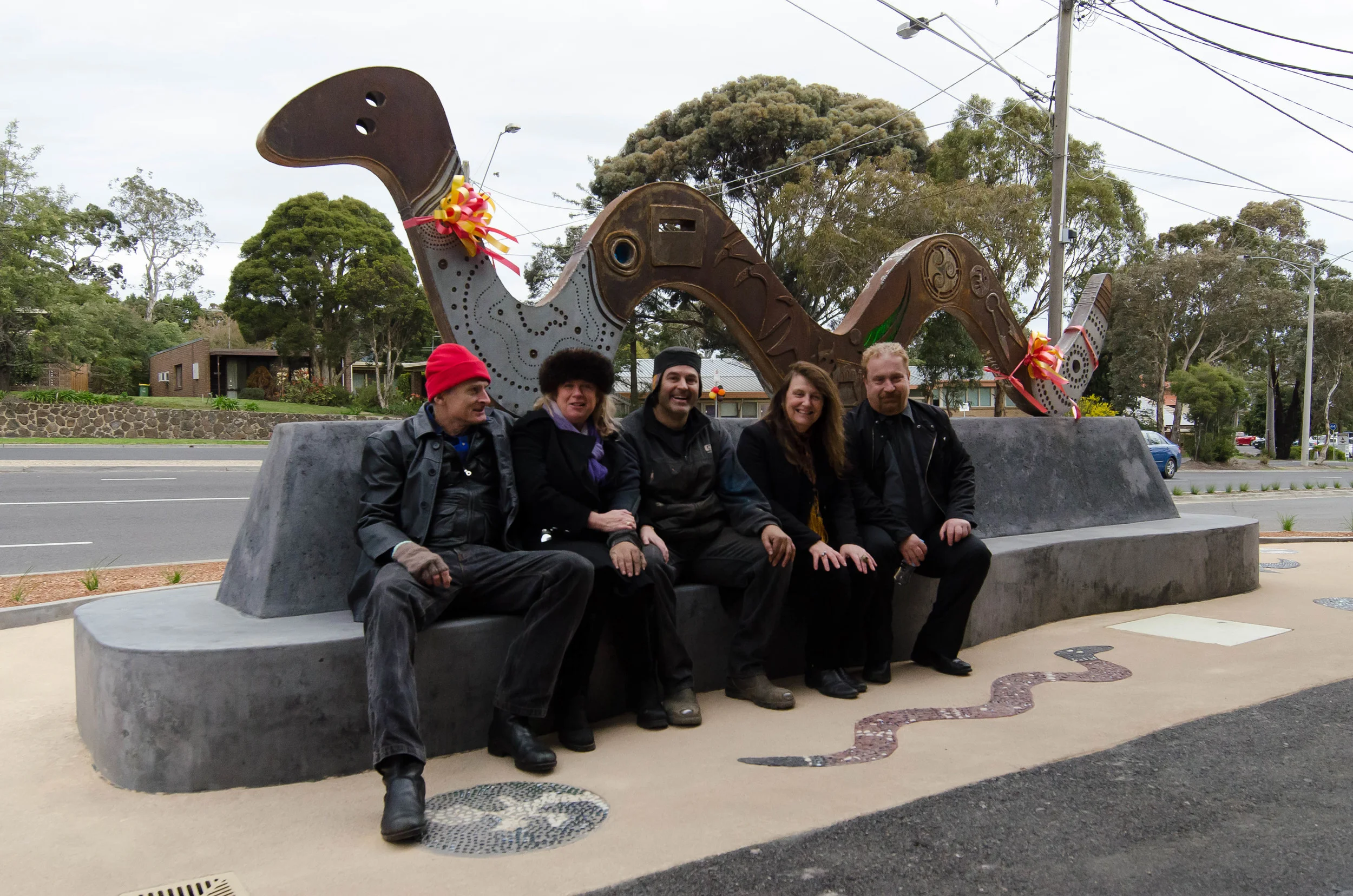 Local community members celebrating the completion of the Lower Plenty Centre's unique serpent sculpture.