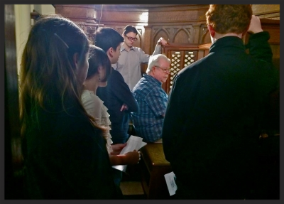 George Bozeman demonstrates the Hutchings-Votey organ at the First Church of Christ, Scientist in Concord, NH to an eager crowd of YOC students.