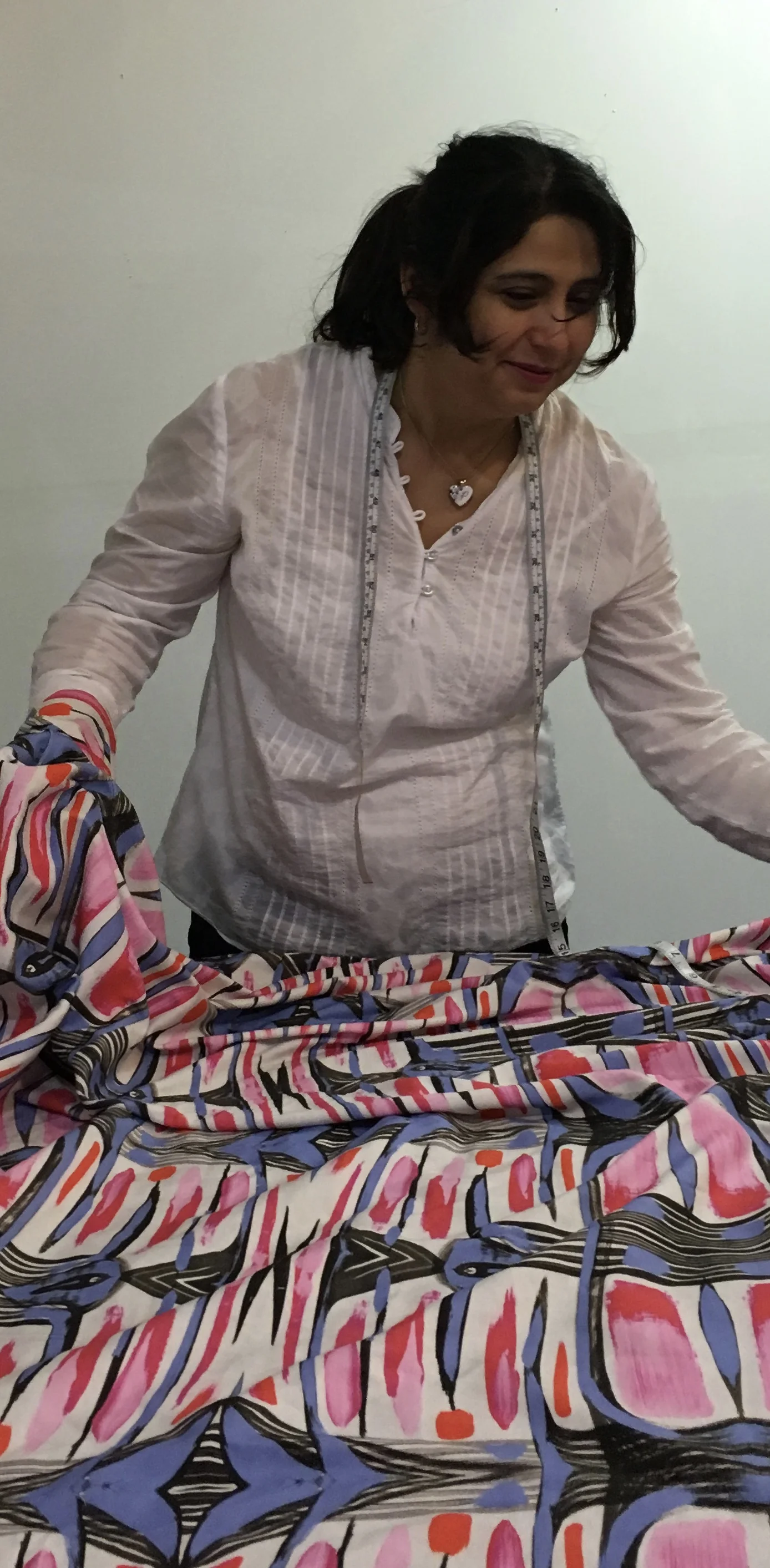Head tailor Paty Alfaro checks for scale and color