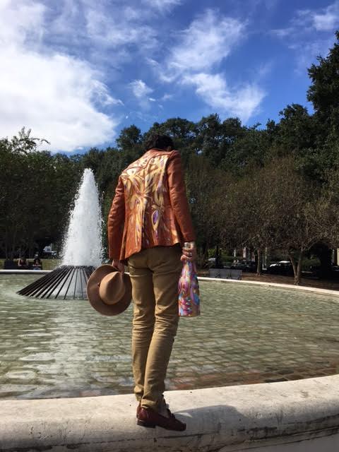 Collin is rocking a hand painted leather jacket (price upon request), fitted khakis he scored at Buffalo Exchange, a hat from Meyer the Hatter and his favorite Cole Haan loafers with woven detail and cross strap. He's hefting a custom Veuve magnum , which can be had for $650.