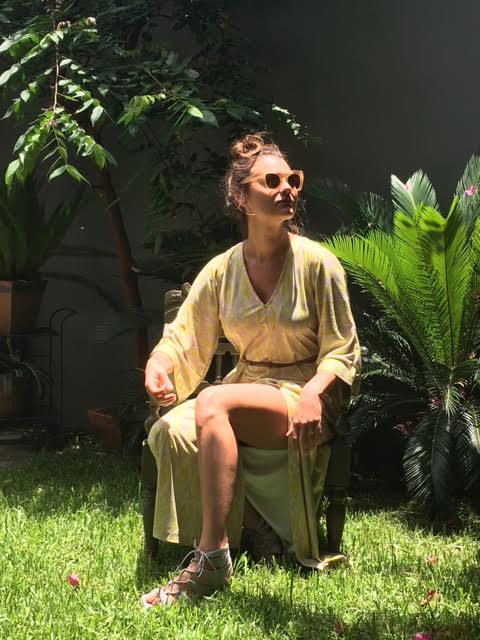 Morgan is wearing the "Amanda" kaftan in the Moonbeam pattern ($380, XS-XL), shades by Krewe D'Optic and shoes scouted by Westerly Vintage