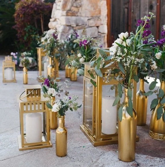 gold-lanterns-and-spray-painted-bottles-wedding-aisle.jpg
