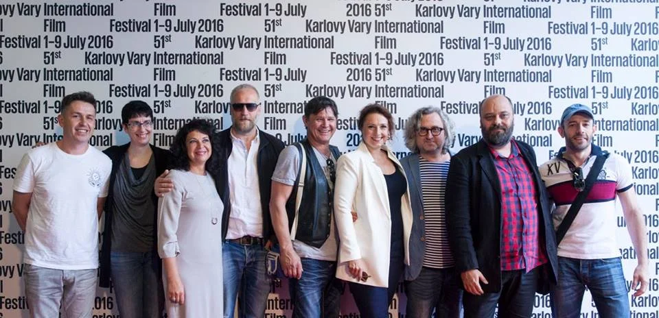 The composer Michal Novinski (the first from the left) before the world premiere of The Teacher on KVIFF, photo by Karlovy Vary International Film Festival, 2016.Hudobný skladateľ Michal Novinski (prvý zľava) pred svetovou premiérou filmu Učiteľka, …