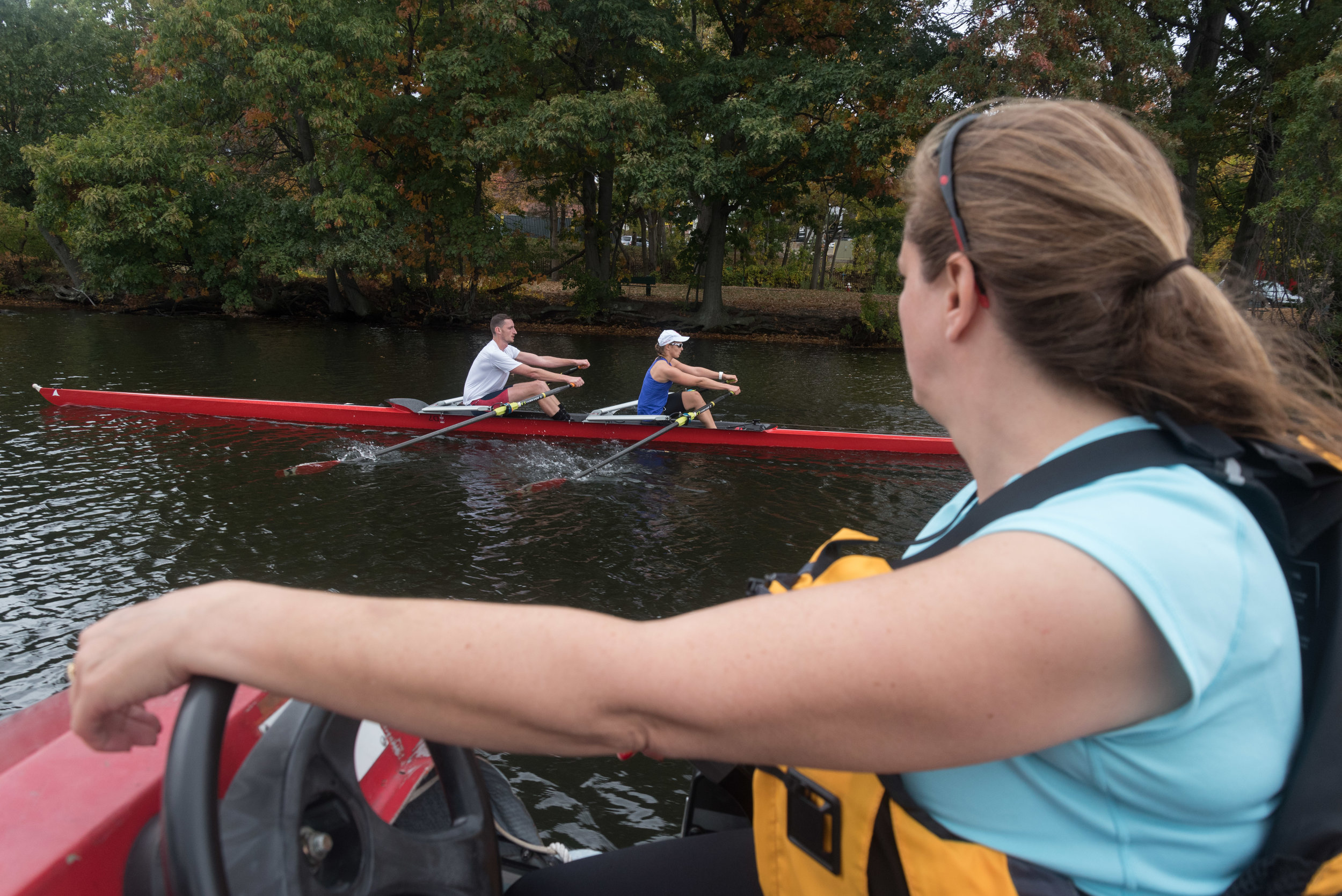  Beth Noll, right, coaches Matt Wheeler and para-rower Johanna Beyer during their practice on Friday, Oct. 21 on the Charles River. Noll said that when Beyer competed in the 2015 regatta, she was noticed by the Austrian national team, her home countr