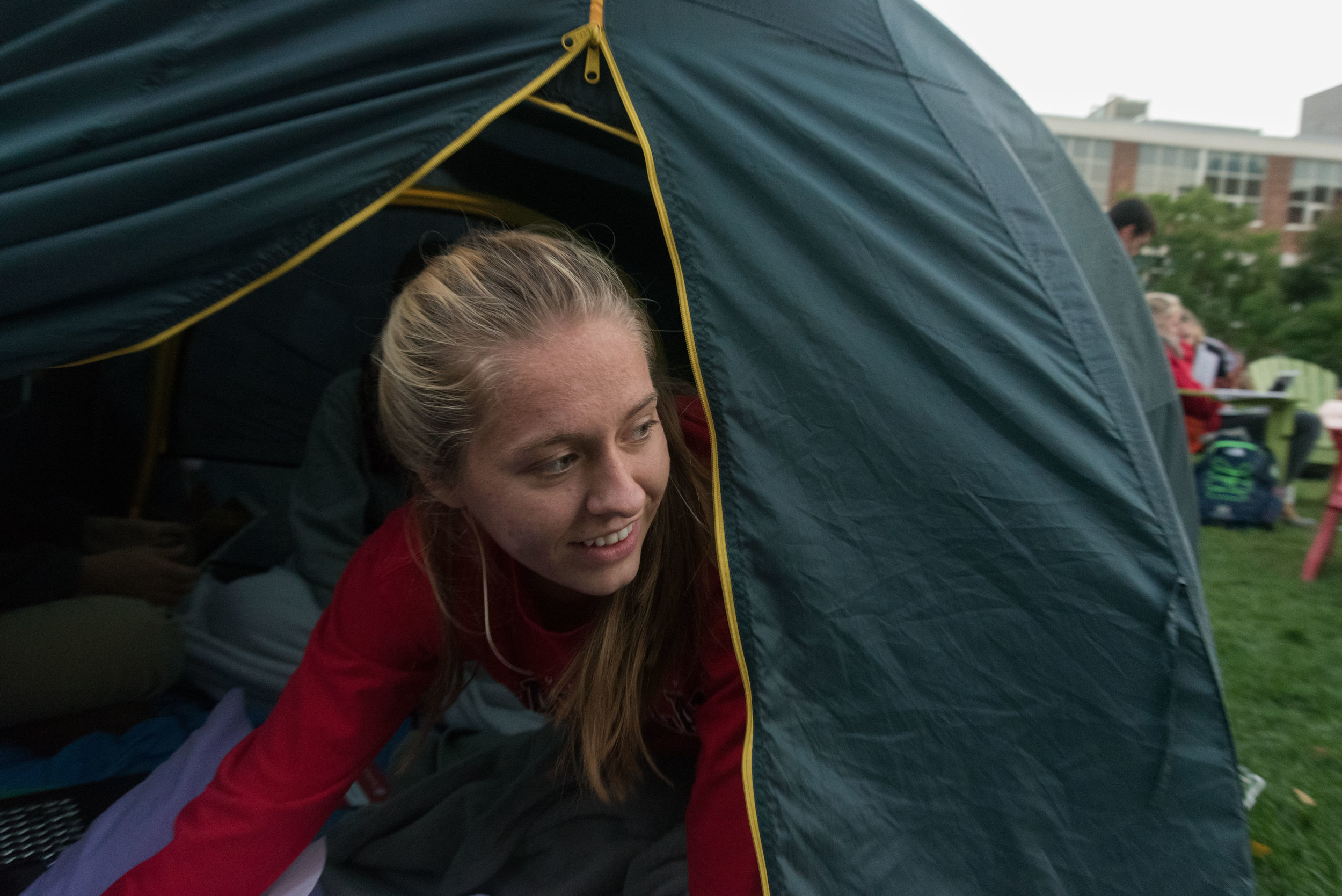  DivestNU member and freshman Brianna Brazee pokes her head out of a tent on Centennial Common on Tuesday, Oct. 4, 2016. At 6 p.m. that evening DivestNU conducted a rally on Centennial. 