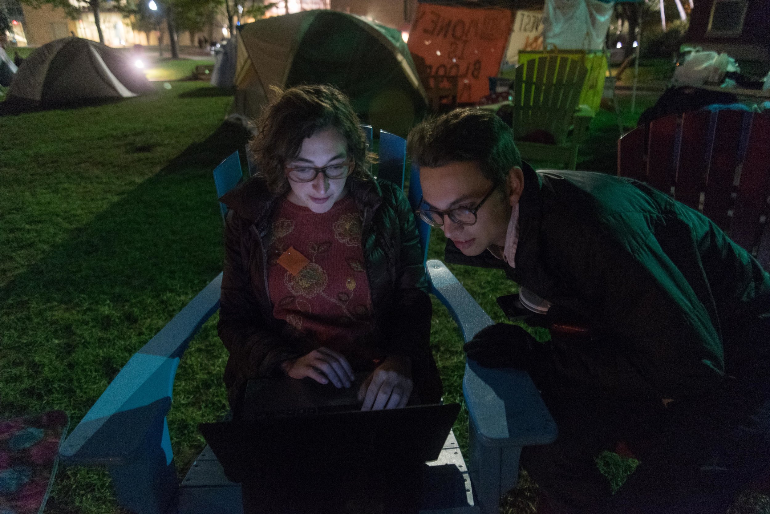  Left to right, DivestNU members Alissa Zimmer and Nick Boyd talk on the night of Thursday, Oct. 13, 2016. As part of the group's protest, dozens of students slept on Centennial Common in tents for almost two weeks.  "I have always been an environmen