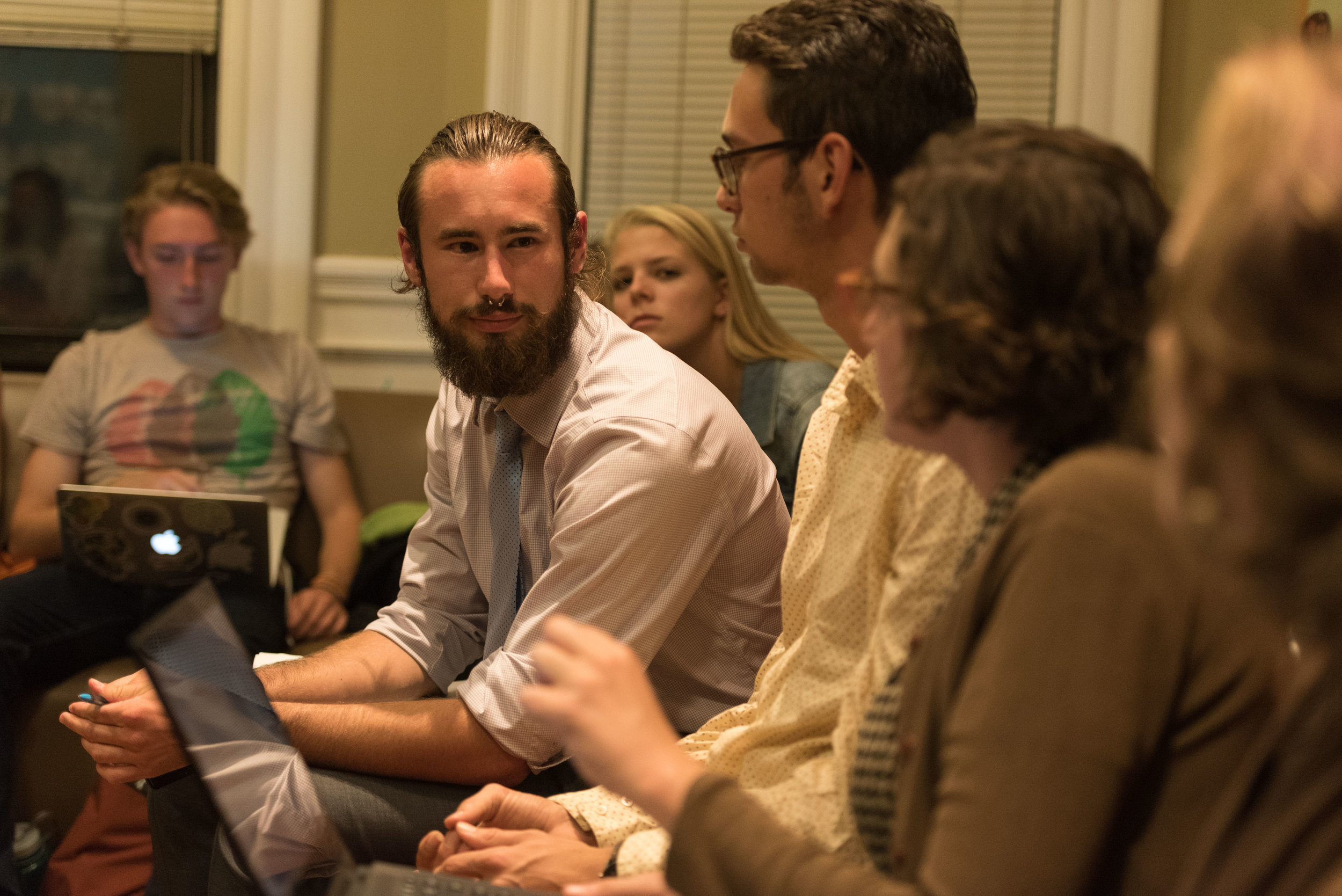  DivestNU co-founder Austin Williams, left, listens to member Alissa Zimmer as they discuss their plans to protest the 2016 State of the University event on the night of Tuesday, Oct. 18, 2016. The meeting served as both planning and debriefing for t