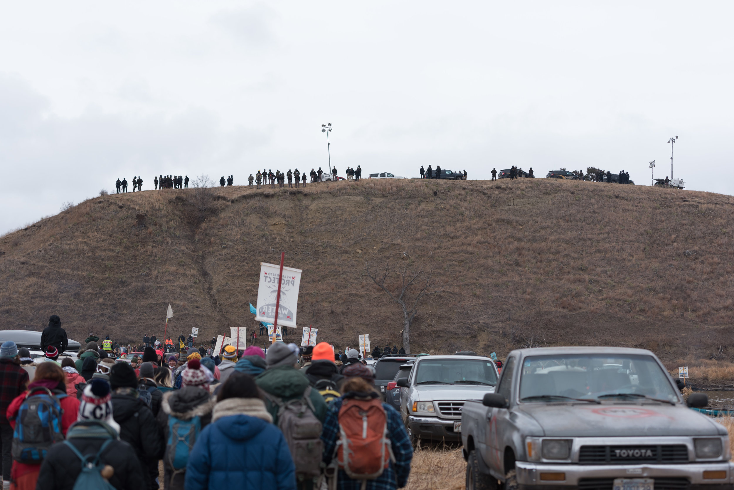  CANNON BALL, North Dakota — Water protectors march from Oceti Sakowin to Turtle Island to help other protesters on Thursday, Nov. 24. Standing Rock Sioux say that Turtle Island is a a sacred burial ground and part of the Dakota Access Pipeline is sc