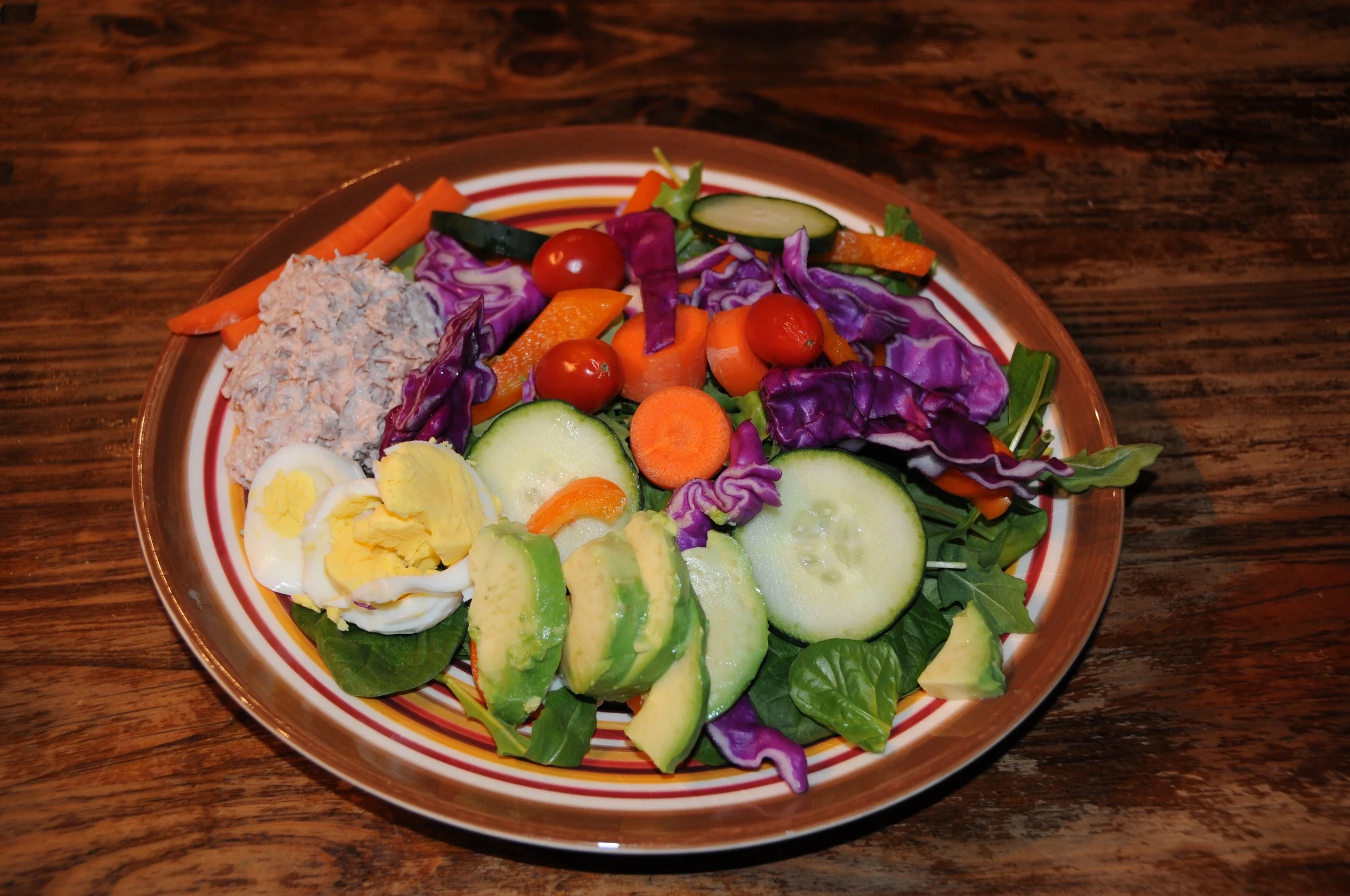 A big salad for lunch topped with a hard-boiled egg (another great protein source) and some tuna