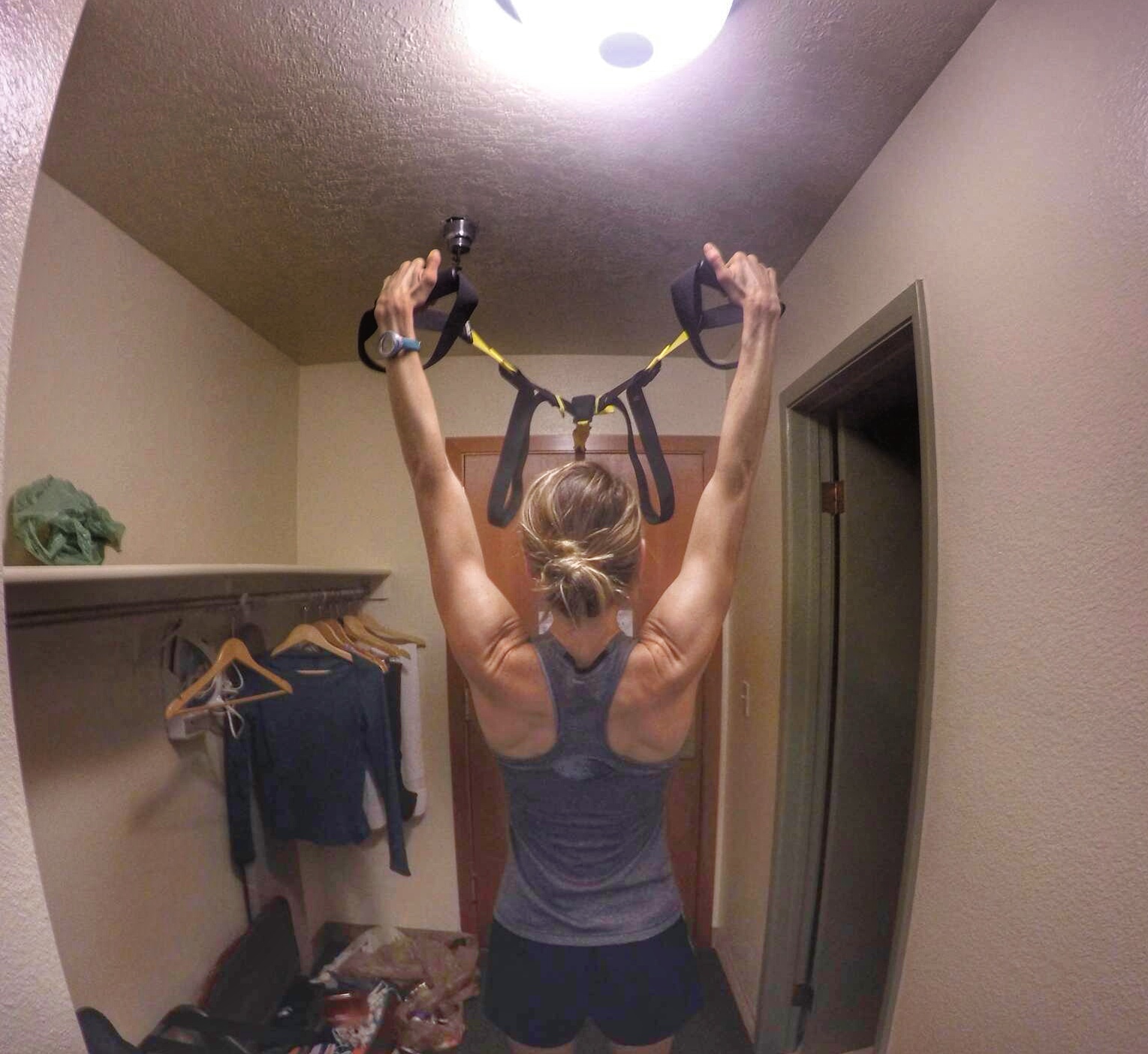 I absolutely love my TRX. It enables me to get a full-body functional strength session in and I can vary the ease or difficulty of the exercise simply by changing my position. It works well over a doorway as can be seen here or could even be hung from a tree in a park outside. It's great for travel as it packs down to a very small bag and is great for a good home workout.