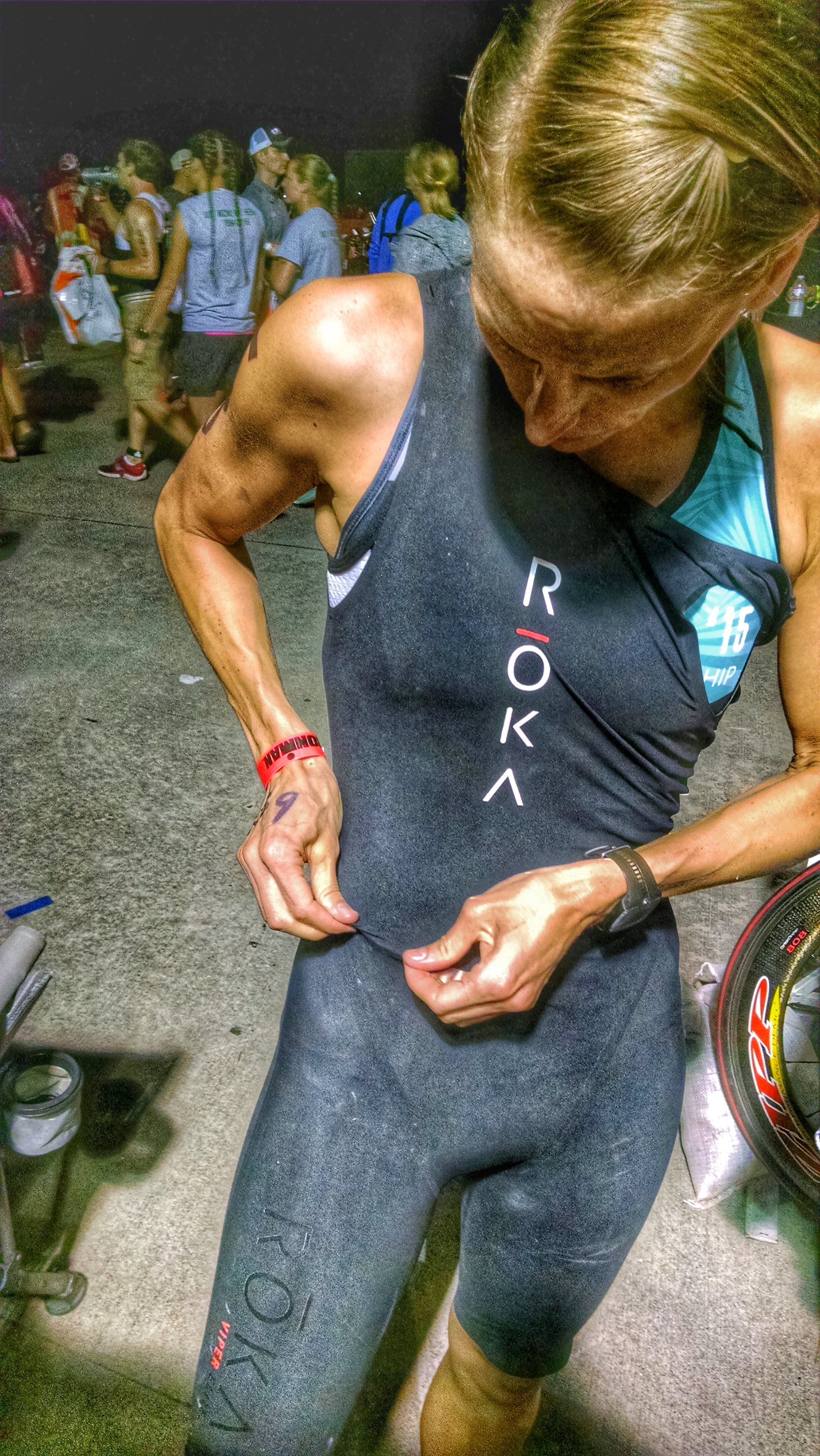 This is me race morning getting my swim skin on. I know the picture seems rather large. I'm clearly not that tech savvy and haven't figured out how to size pictures just yet on this blog so please JUST DEAL WITH IT!!