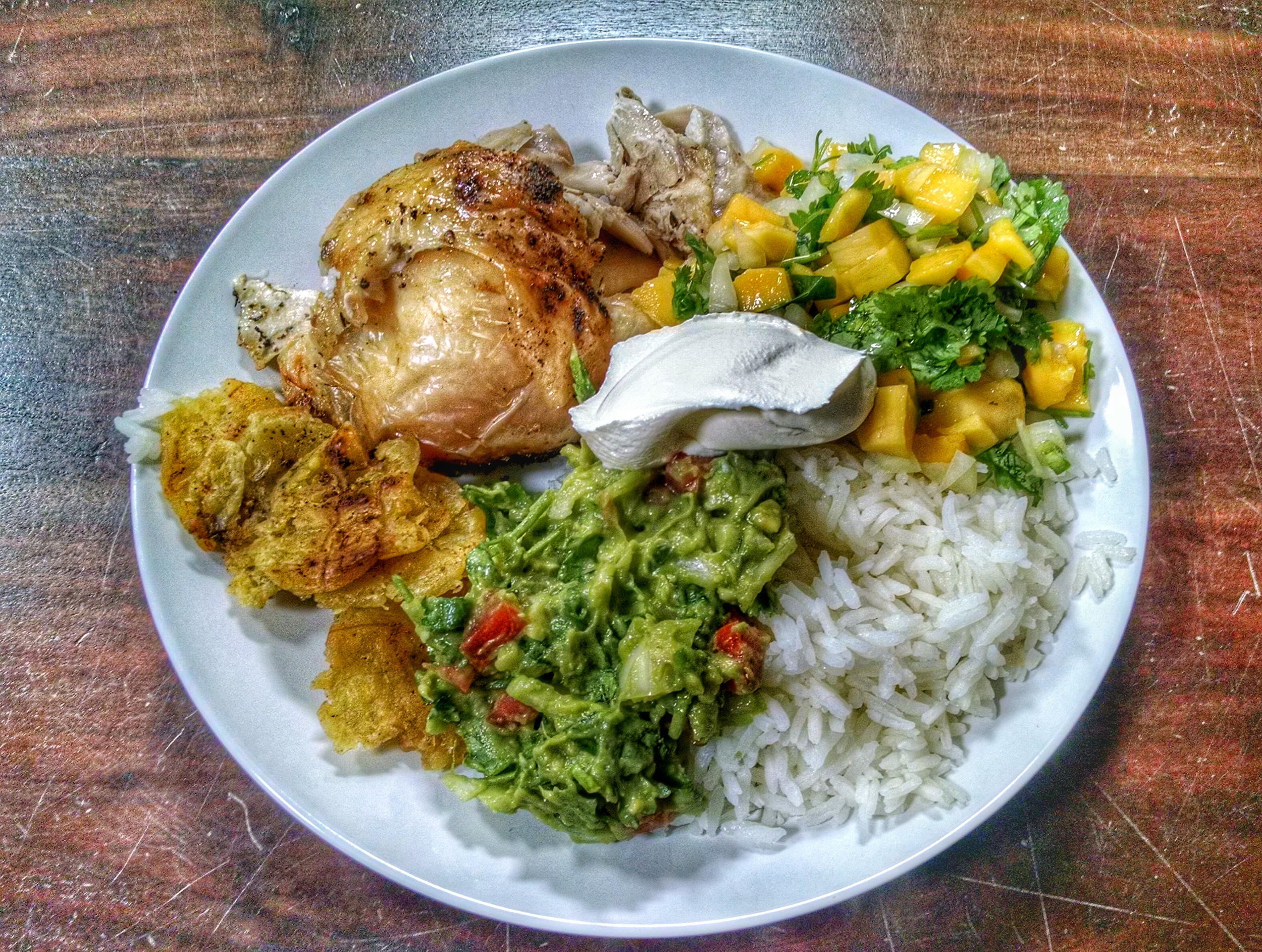 Another dinner... This time we had oven-roasted organic chicken served with jasmine rice, plantain chips and a side of home-made guacamole, mango salsa and sour cream