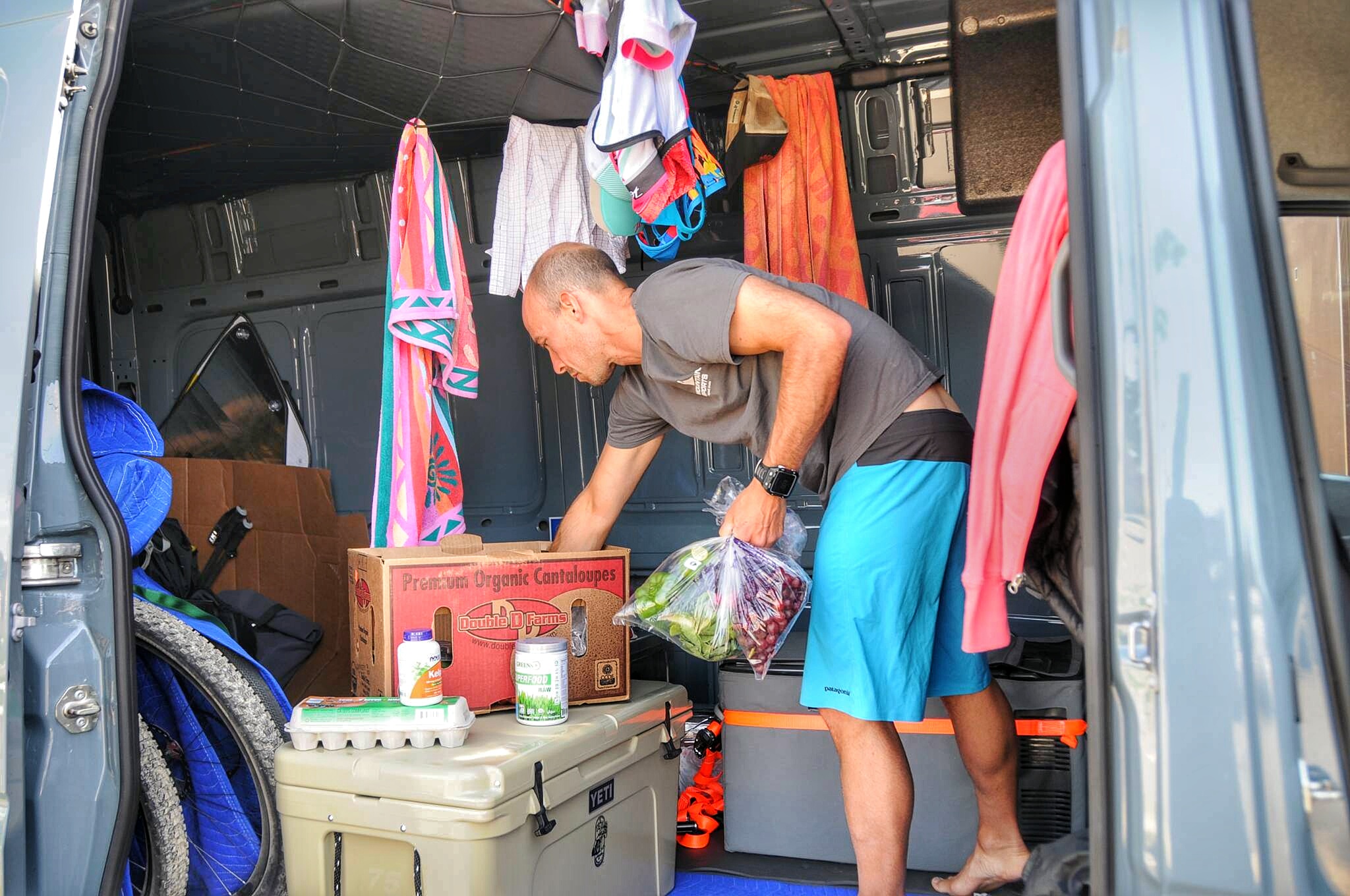 After getting our home-on-wheels clean, it was time to stock up on groceries. Here Matt is restocking the coolers with fresh produce.