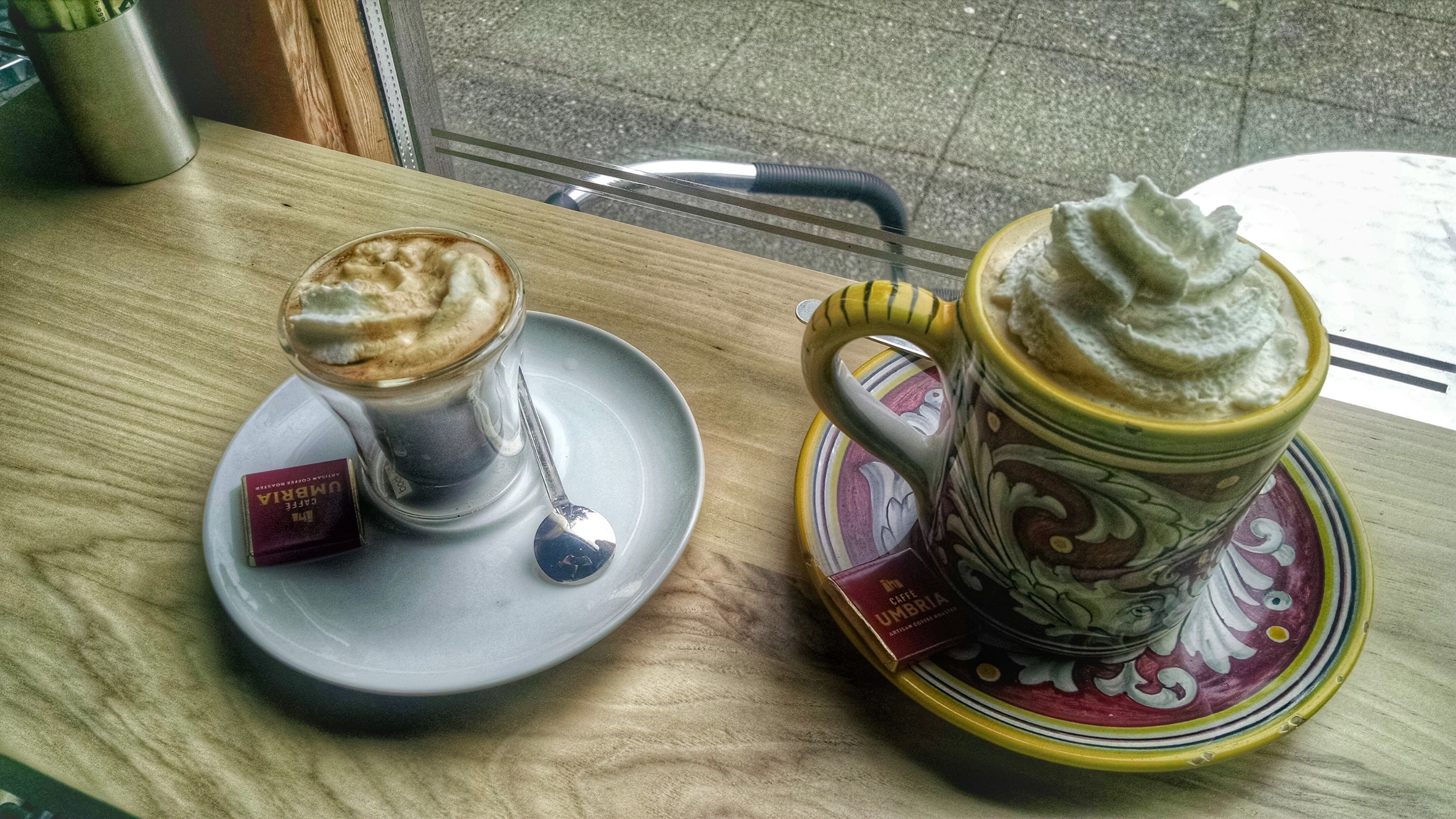Espresso con panna and Americano con panna (aka with a dollop of whipped cream). Also notice the little chocolate served with each cup. Chocolate?? YES please!!
