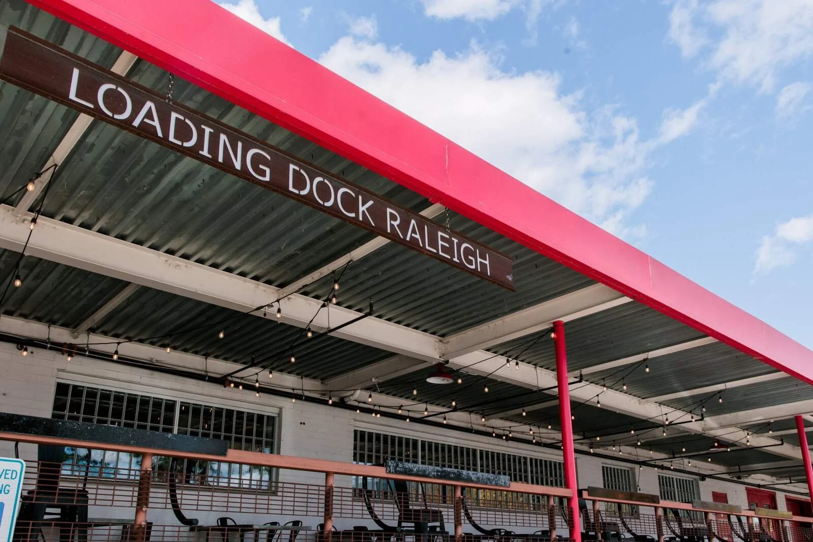 Dock-1053_Exterior_signage-overhead-canopy-string-lights_2025.jpg