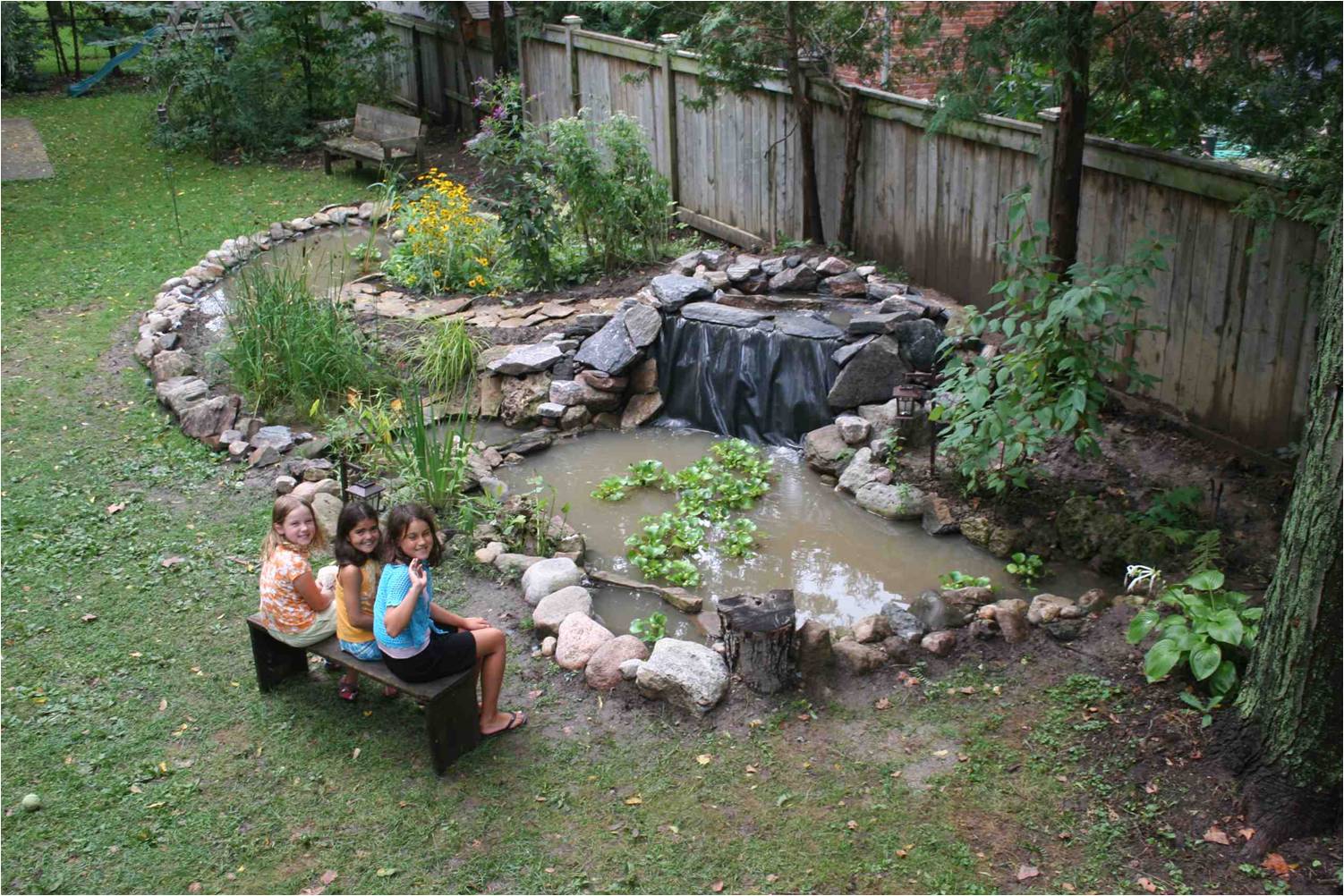 A backyard wetland system (this photo shows final stages before completion) was created in our yard, featuring two ponds (one deep with fish, the other shallow for dragonflies), a main waterfall, a spillway and 'marsh filter' were installed. The wildlife stampeded back filling our lives with lots to watch and many amazing stories to retell. 