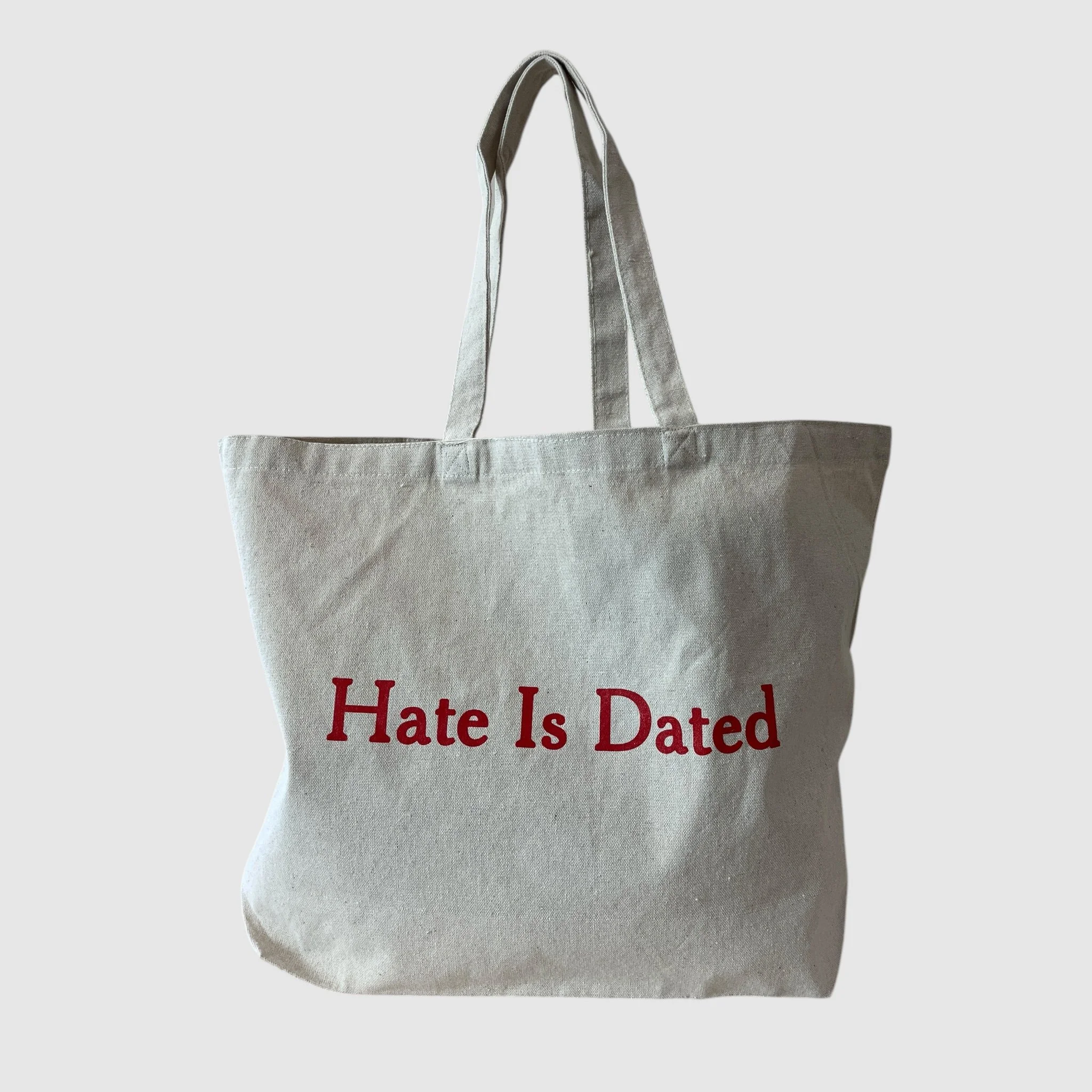 Hate Is Dated Totoe Bag sitting.JPG