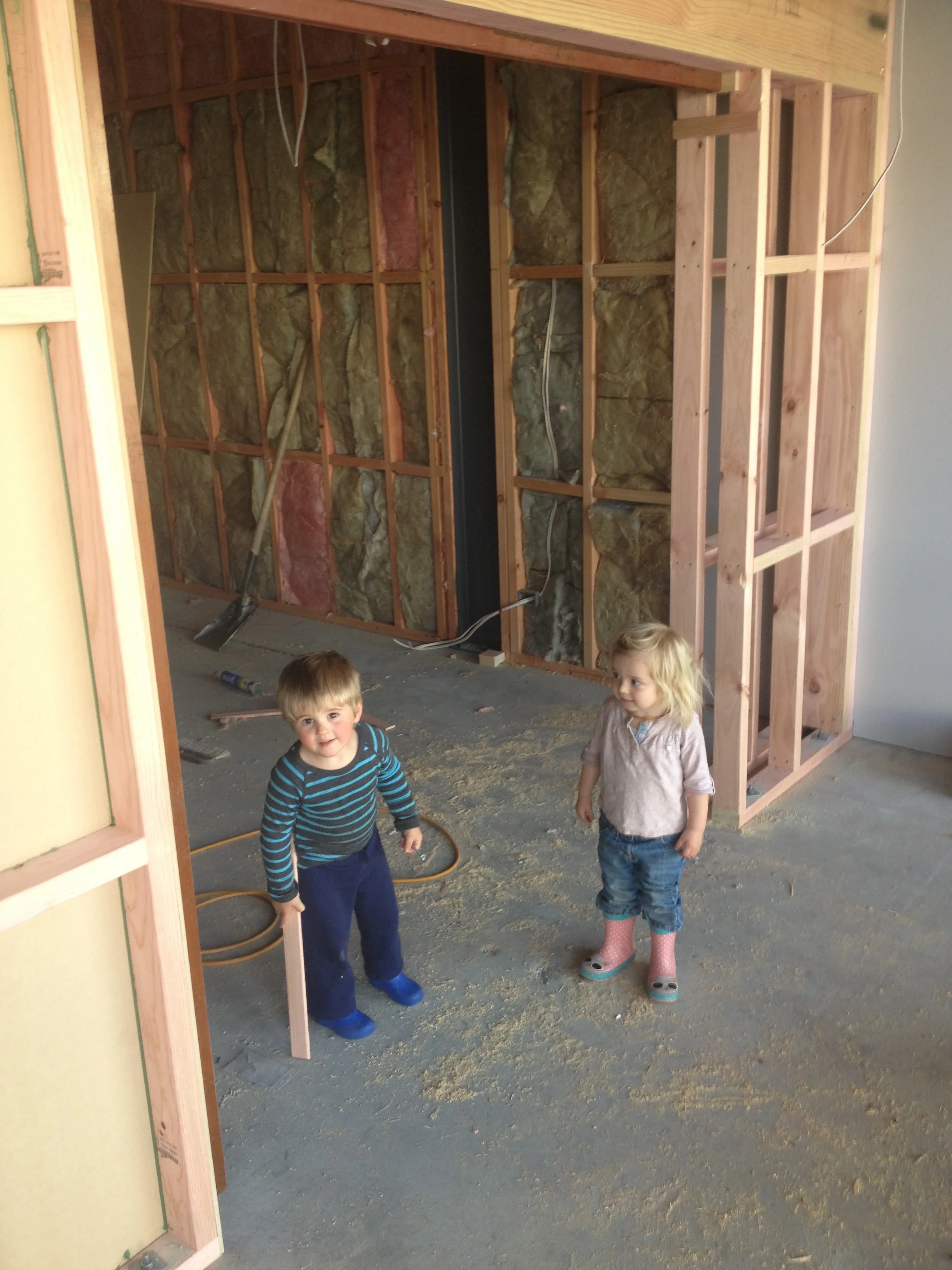 Indigo and cousin Jed help tidy the building site