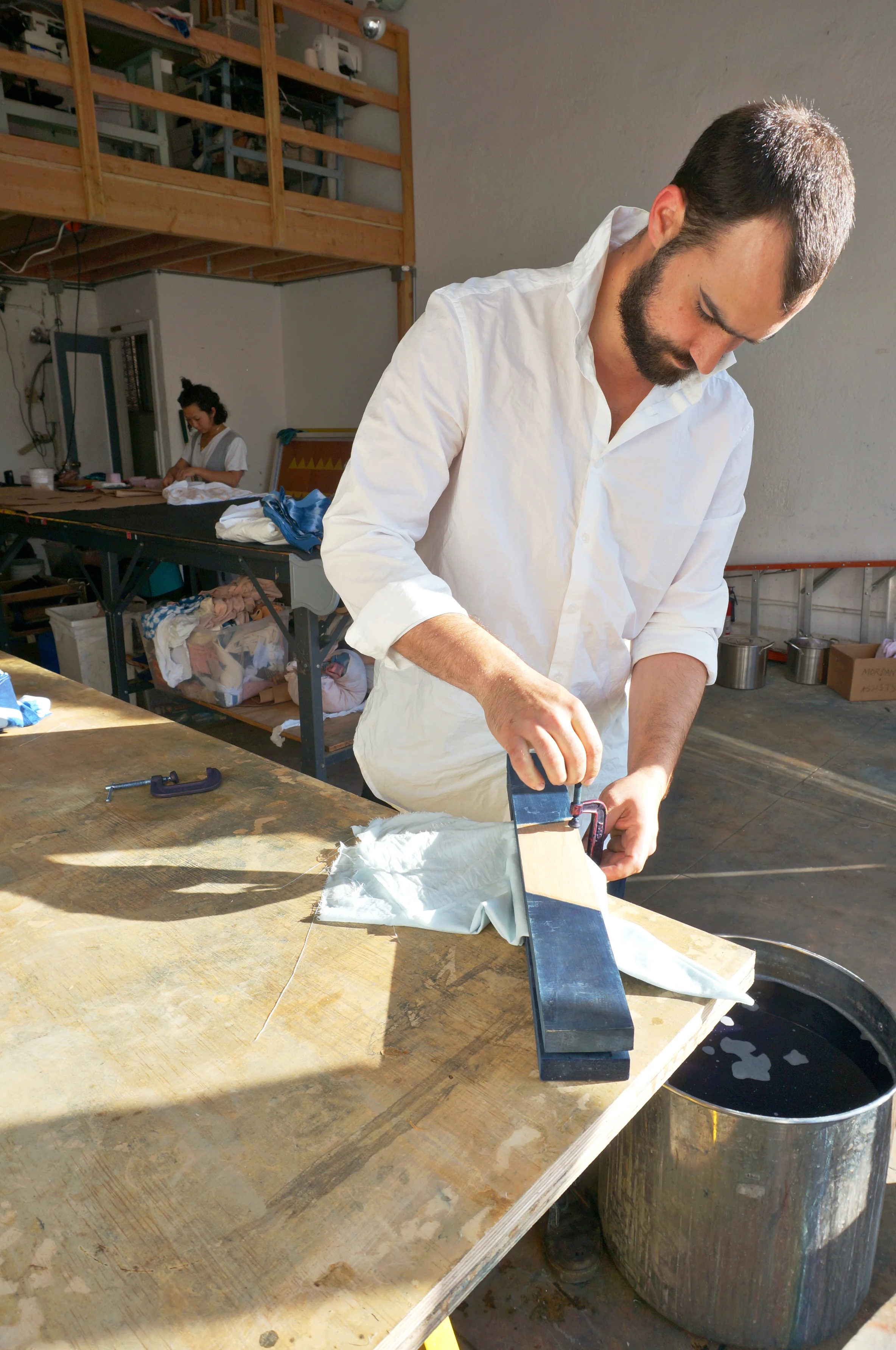 Clamps and wood boards combined with the folds create the dye pattern