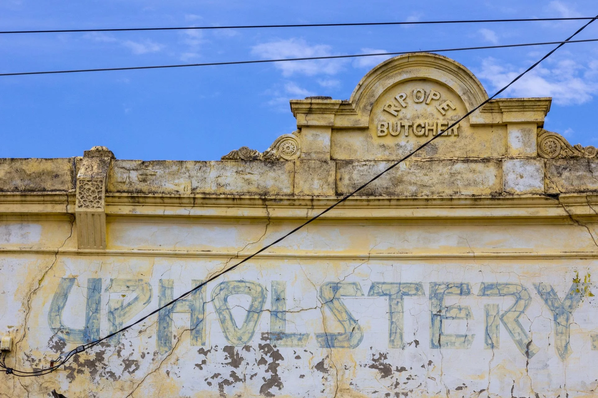 Layers of history etched into the facade with this ghost sign &mdash; traces of a butcher and an upholsterer still linger, whispering stories of Carlton North&rsquo;s past.

 #Melbourne #MelbournePhotography #MelbourneFacades #UrbanPhotography #Hidde