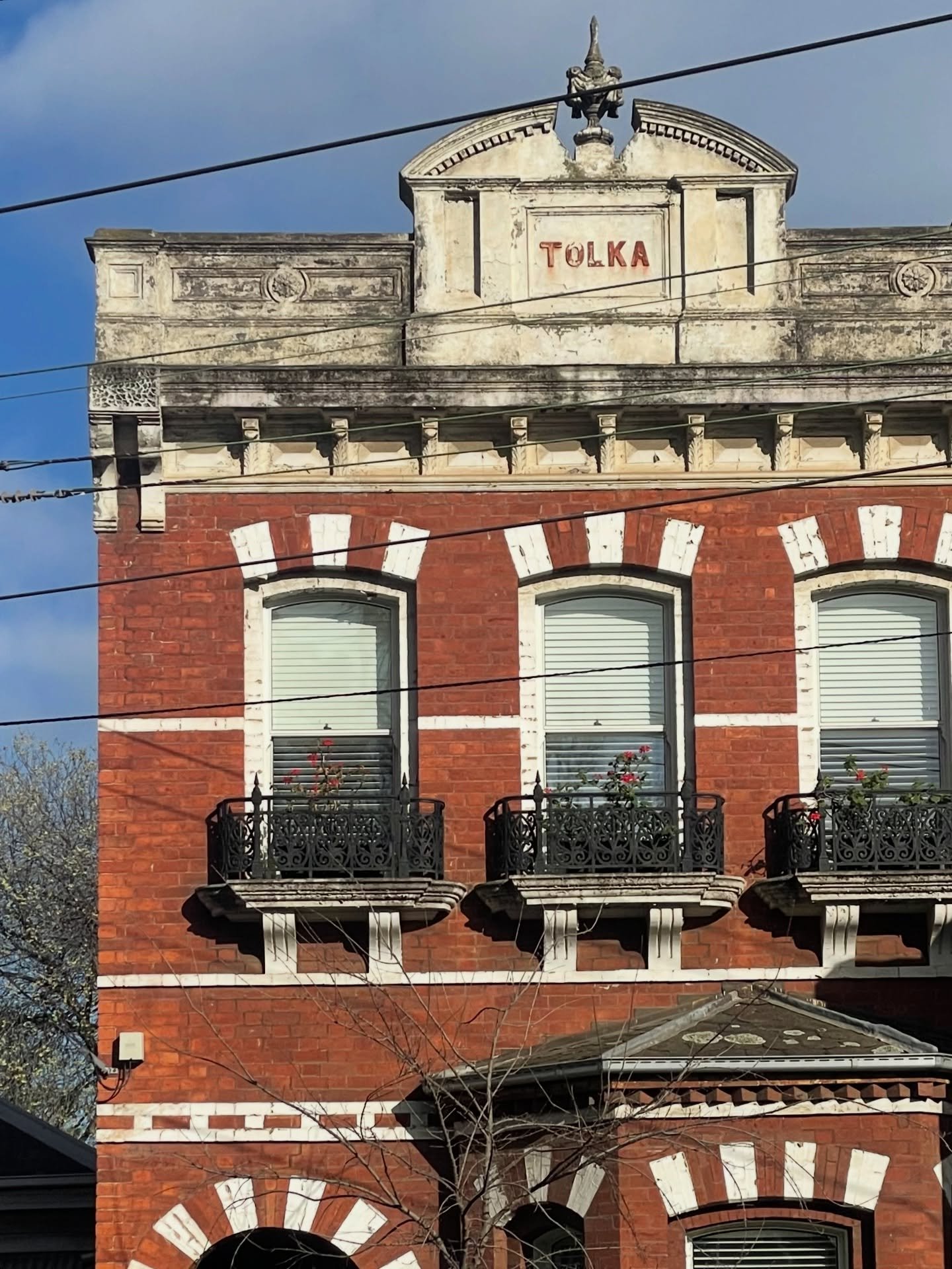 Tolka, Carlton.

A relic of Melbourne&rsquo;s 1880s land boom &mdash; red brick, ornate render, cast-iron balconies and a name etched proudly into the parapet.

Terraces like this signalled status and permanence in a rapidly growing colonial city. To