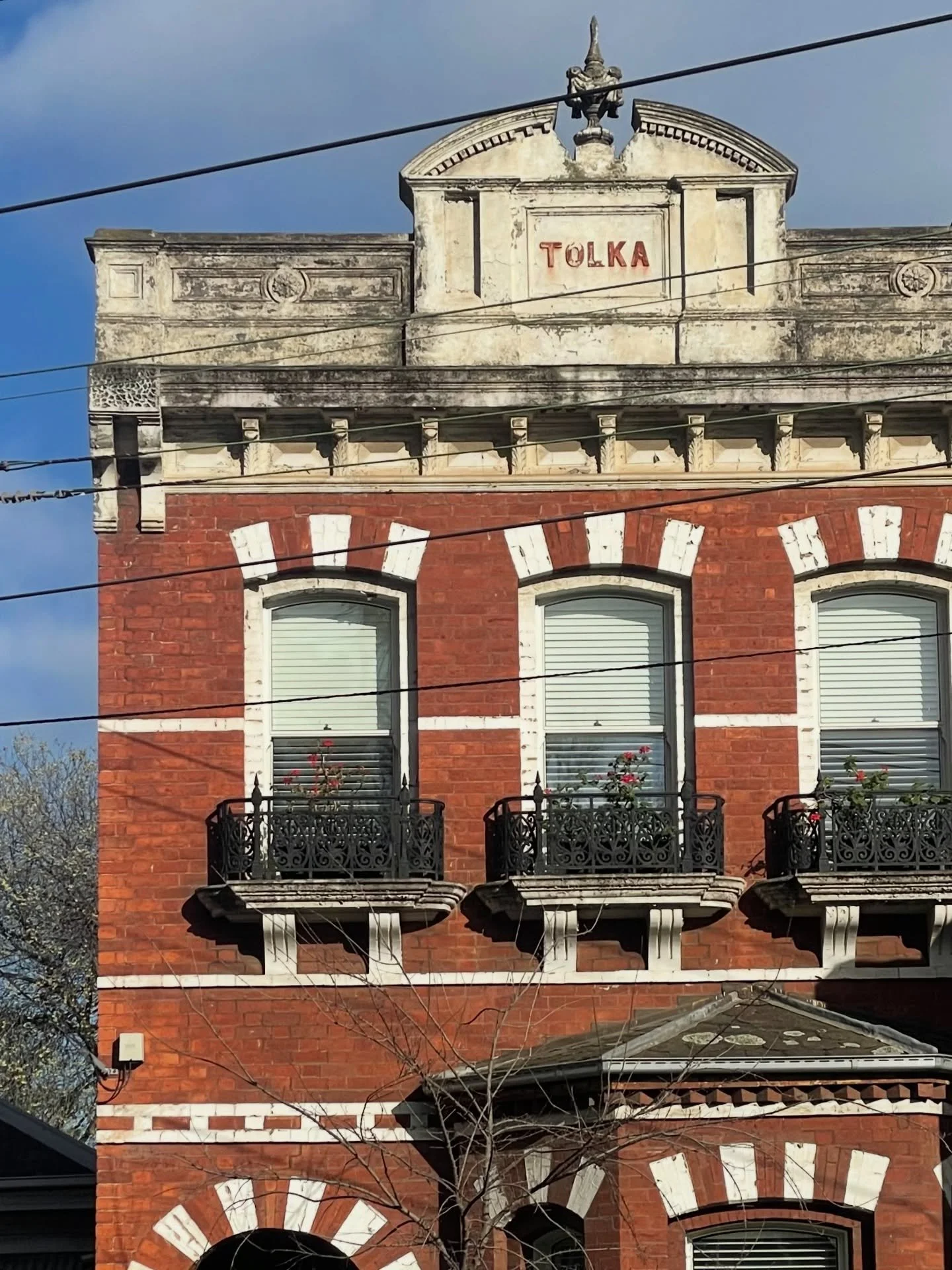 Tolka, Carlton.

A relic of Melbourne&rsquo;s 1880s land boom &mdash; red brick, ornate render, cast-iron balconies and a name etched proudly into the parapet.

Terraces like this signalled status and permanence in a rapidly growing colonial city. To