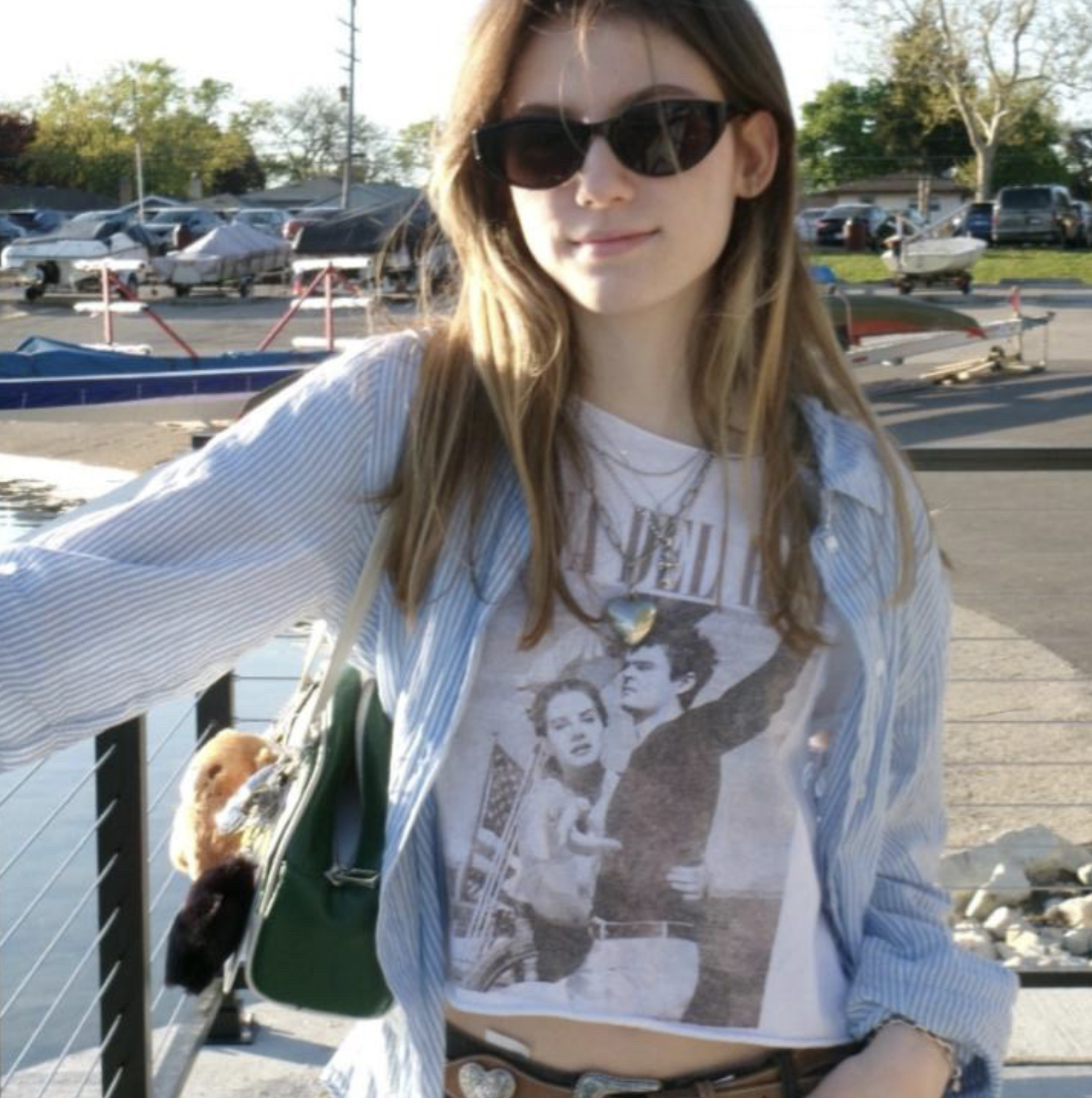 woman in sunglasses posing outside