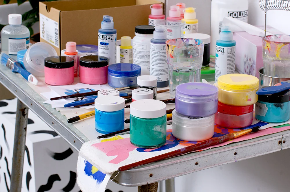 Mixing and testing paint colours. Photo by Susan Fitzgerald.