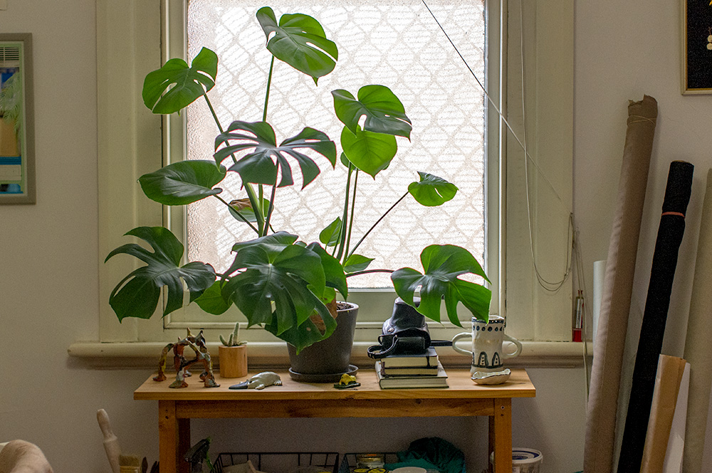 Esther's desk is to the left of the window and her sewing machine is the the right, next to the bolts of fabric. Photo by Susan Fitzgerald.