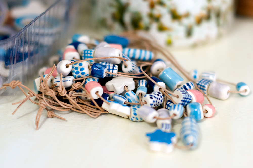 Hand-formed and painted ceramic necklaces. Photo by Susan Fitzgerald.