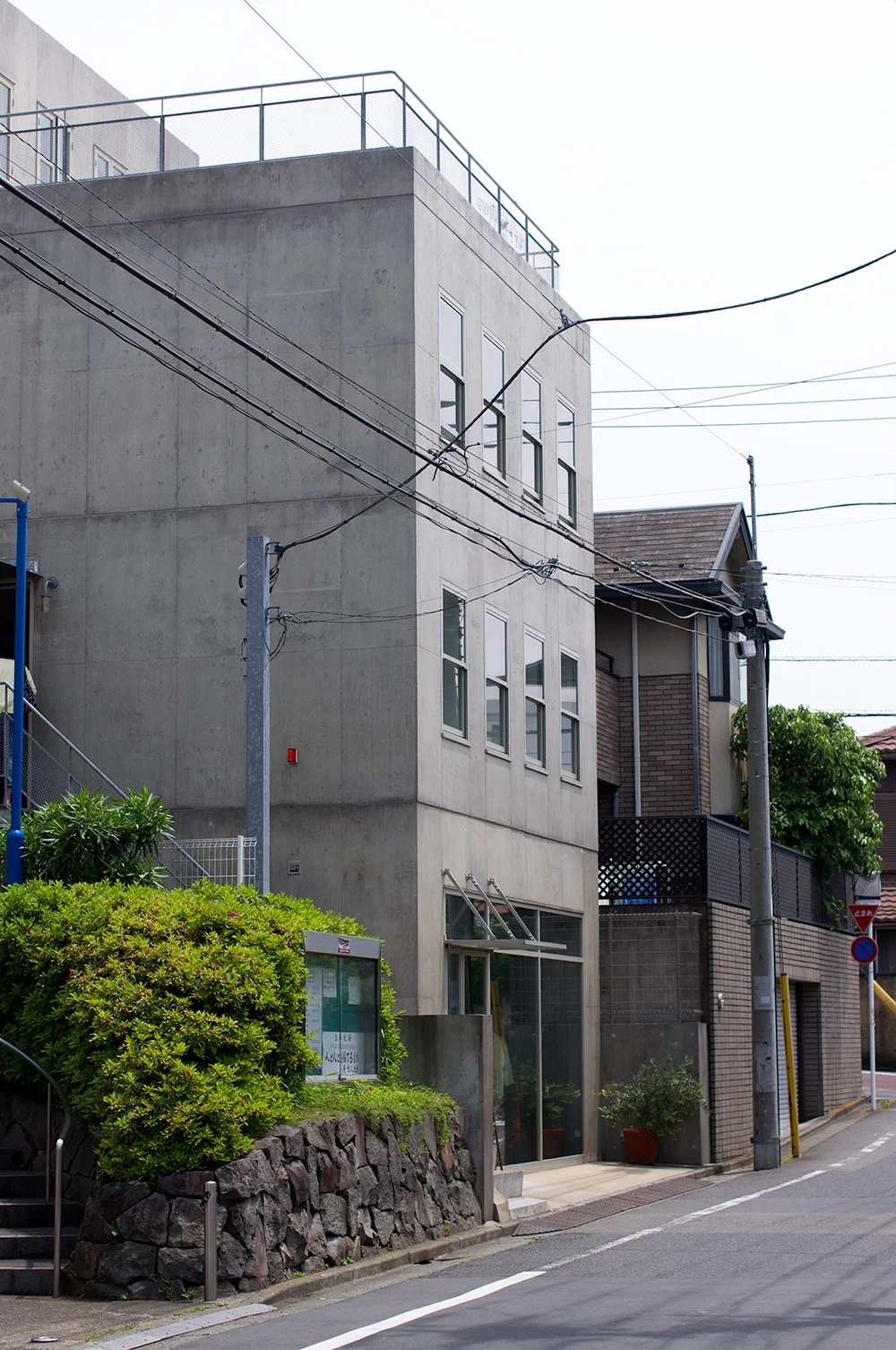 The custom designed and built building is in a relatively quiet street. You can see the three main levels and the smaller, fourth storage area at the top. There's also a balcony area which looks pretty great.