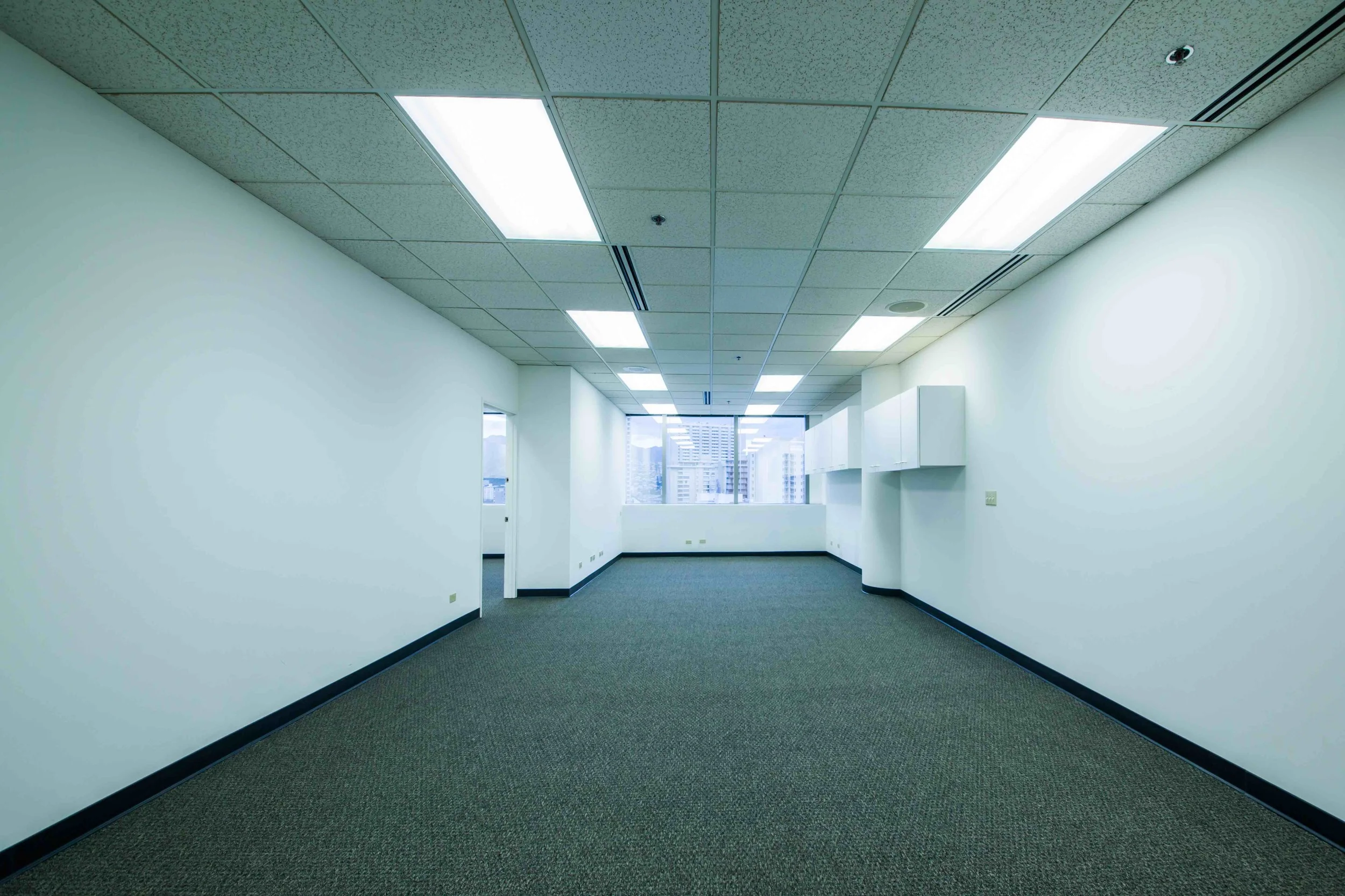 Suite is divided into two parts with an interior connecting door for flexible configuration. Each area of the office has an independent hallway door for separate entrances into the suite. Wall to wall window views of Kalakaua Avenue.
