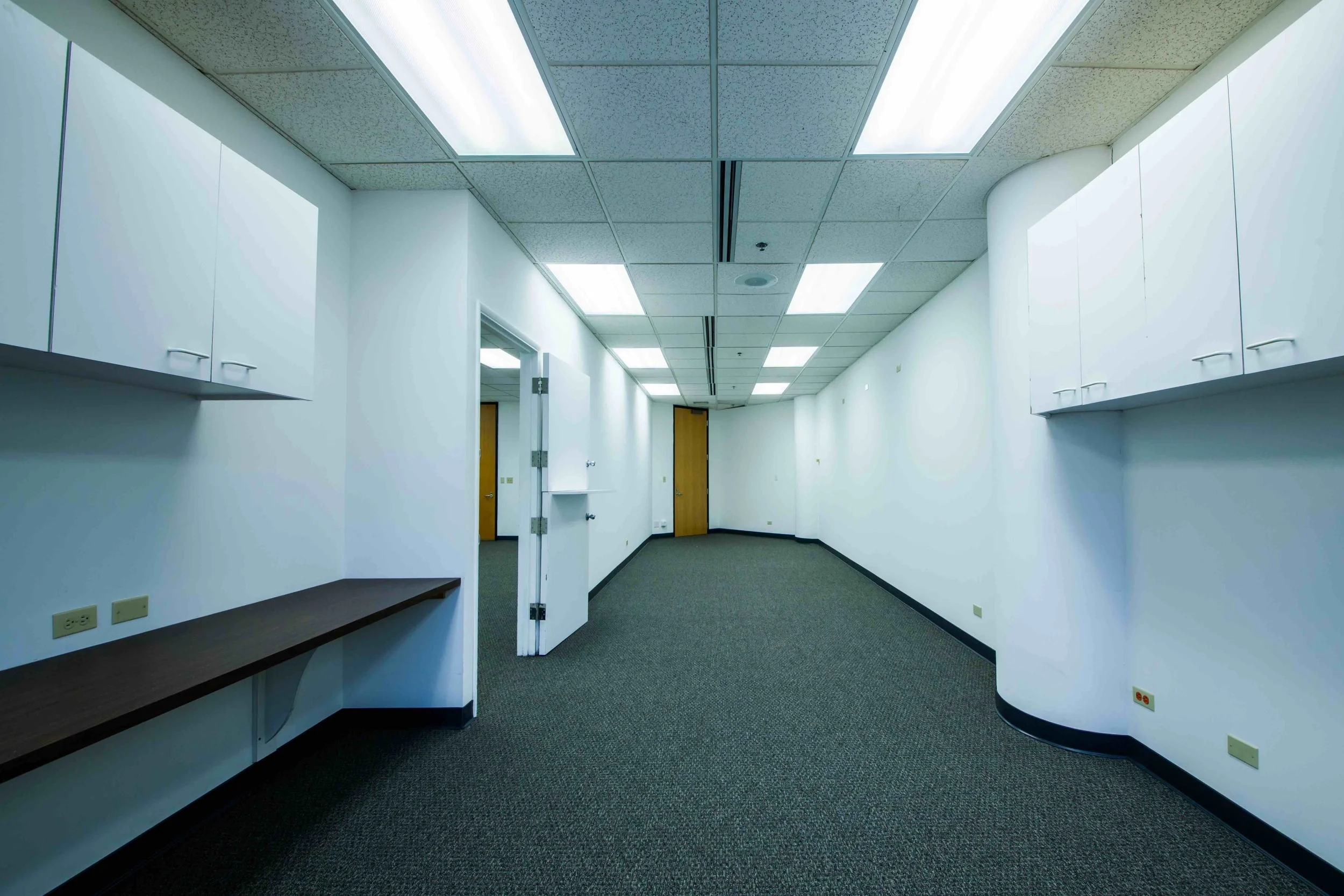 Suite is divided into two parts with an interior connecting door for flexible configuration. Each area of the office has an independent hallway door for separate entrances into the suite. Wall to wall window views of Kalakaua Avenue.