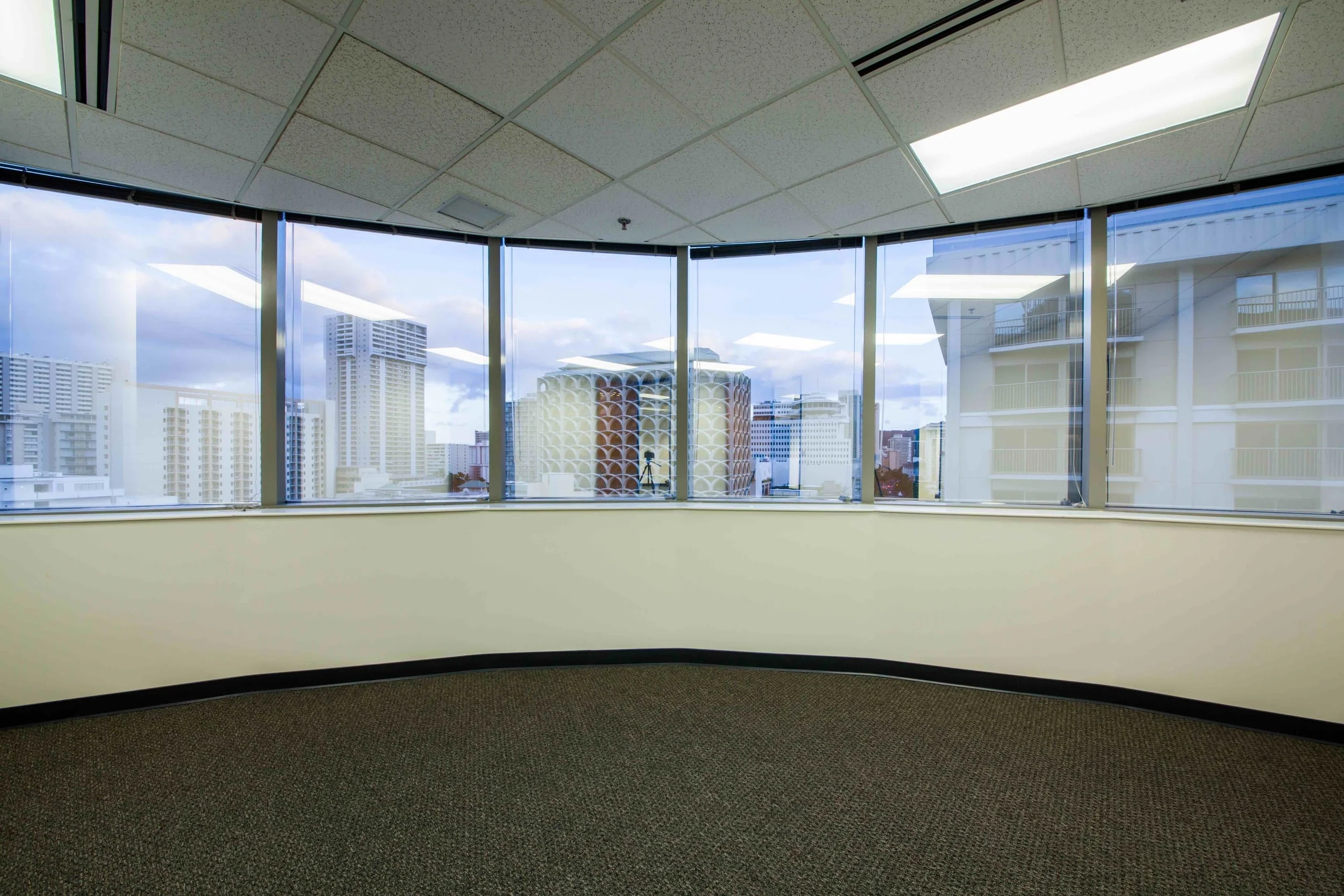 Well appointed office with new carpet and new paint. Wall to wall windows with views of Kalakaua Avenue, Waikiki Galleria Tower and Diamond Head. Fantastic private corner office with curved window views of Kalakaua and Diamond Head.