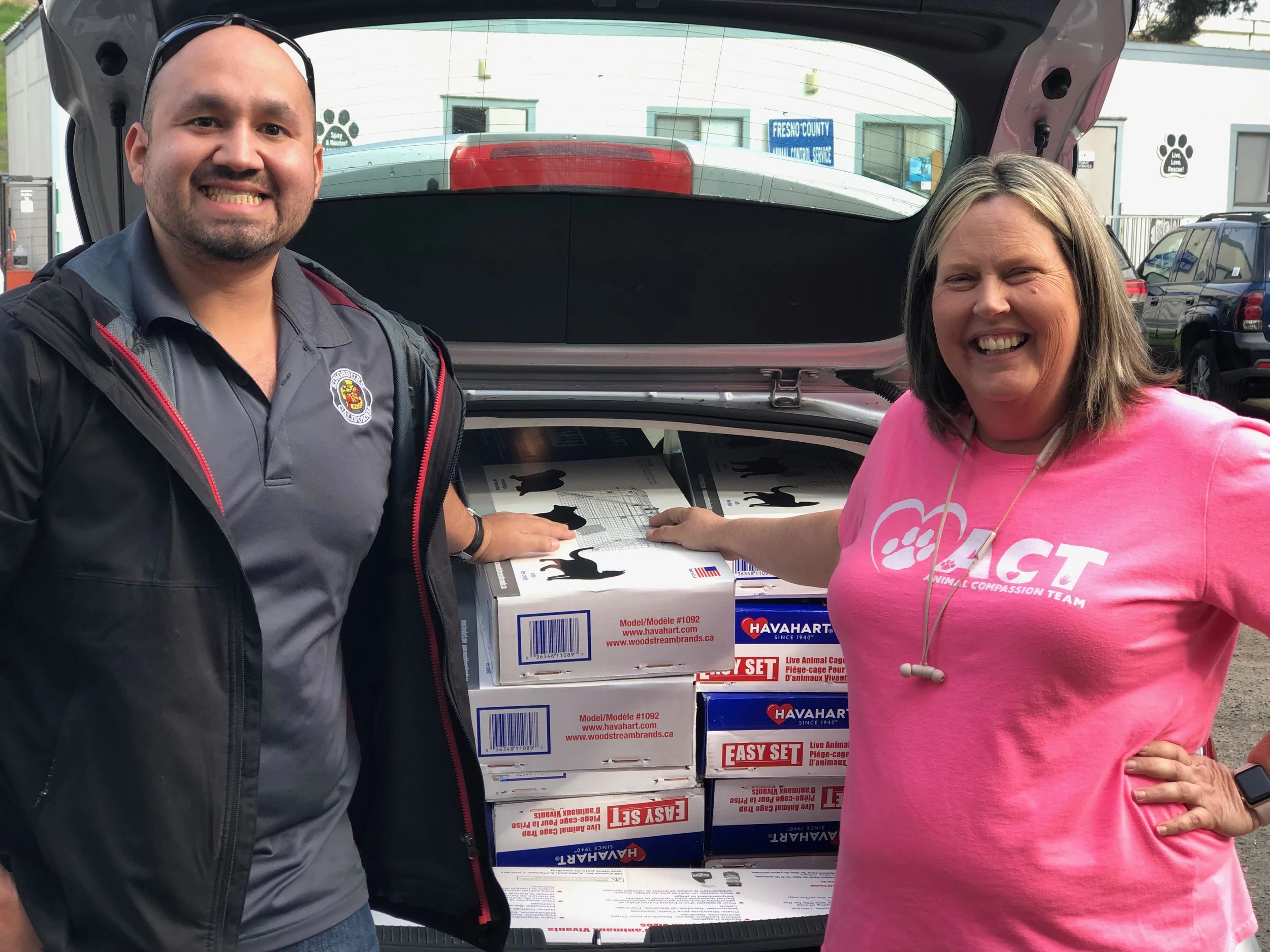 Pictured is Adam Castaneda, Community Services Director for the City of Kingsburg and Brenda Mitchell, President & Chief Life-saving Officer for Fresno Humane Animal Services posing with a full trunk of new cat traps bought with monies from a $5,000 grant gifted by an anonymous donor.